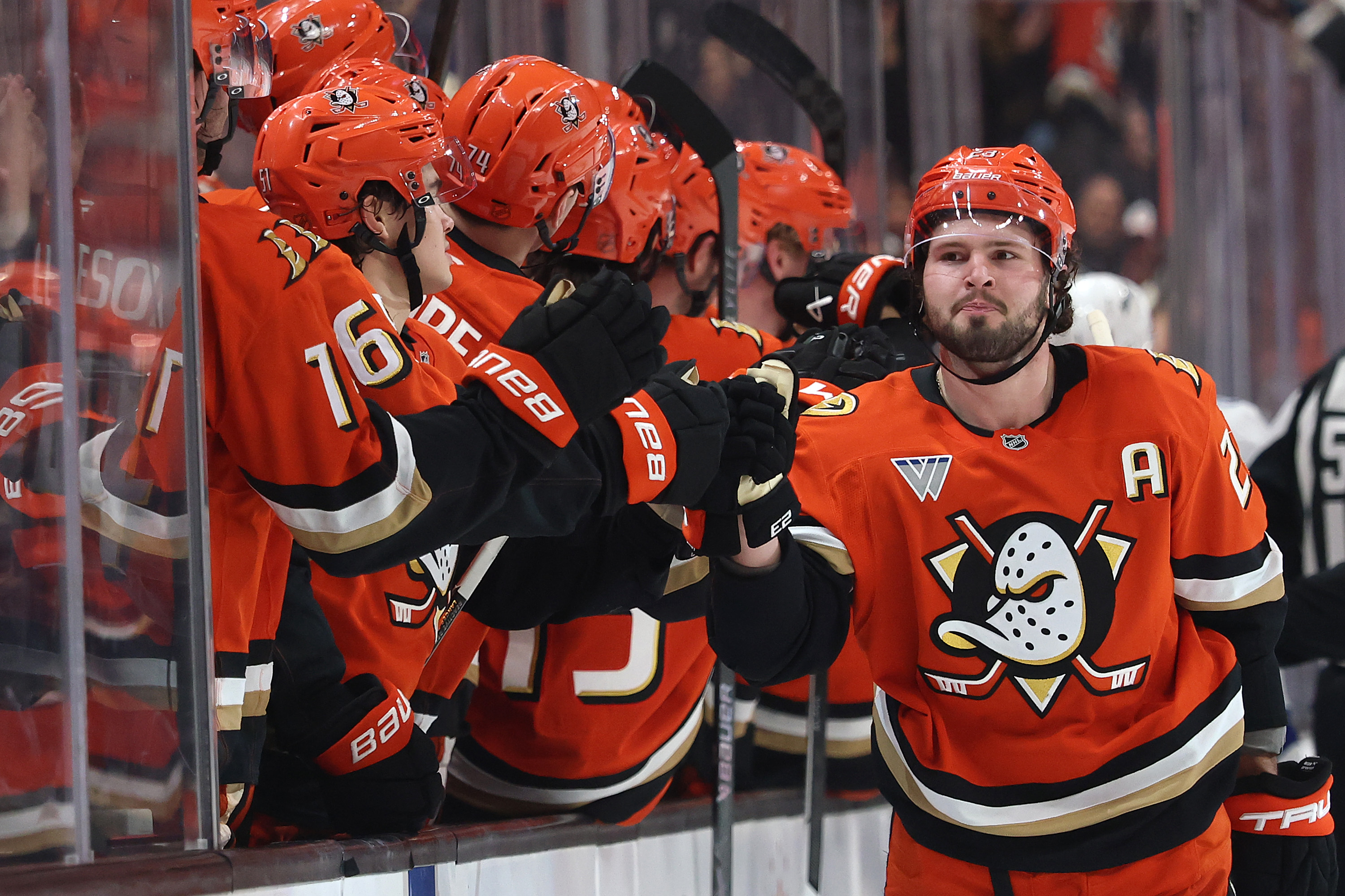 The Ducks’ Mason McTavish, right, is congratulated by teammates on...