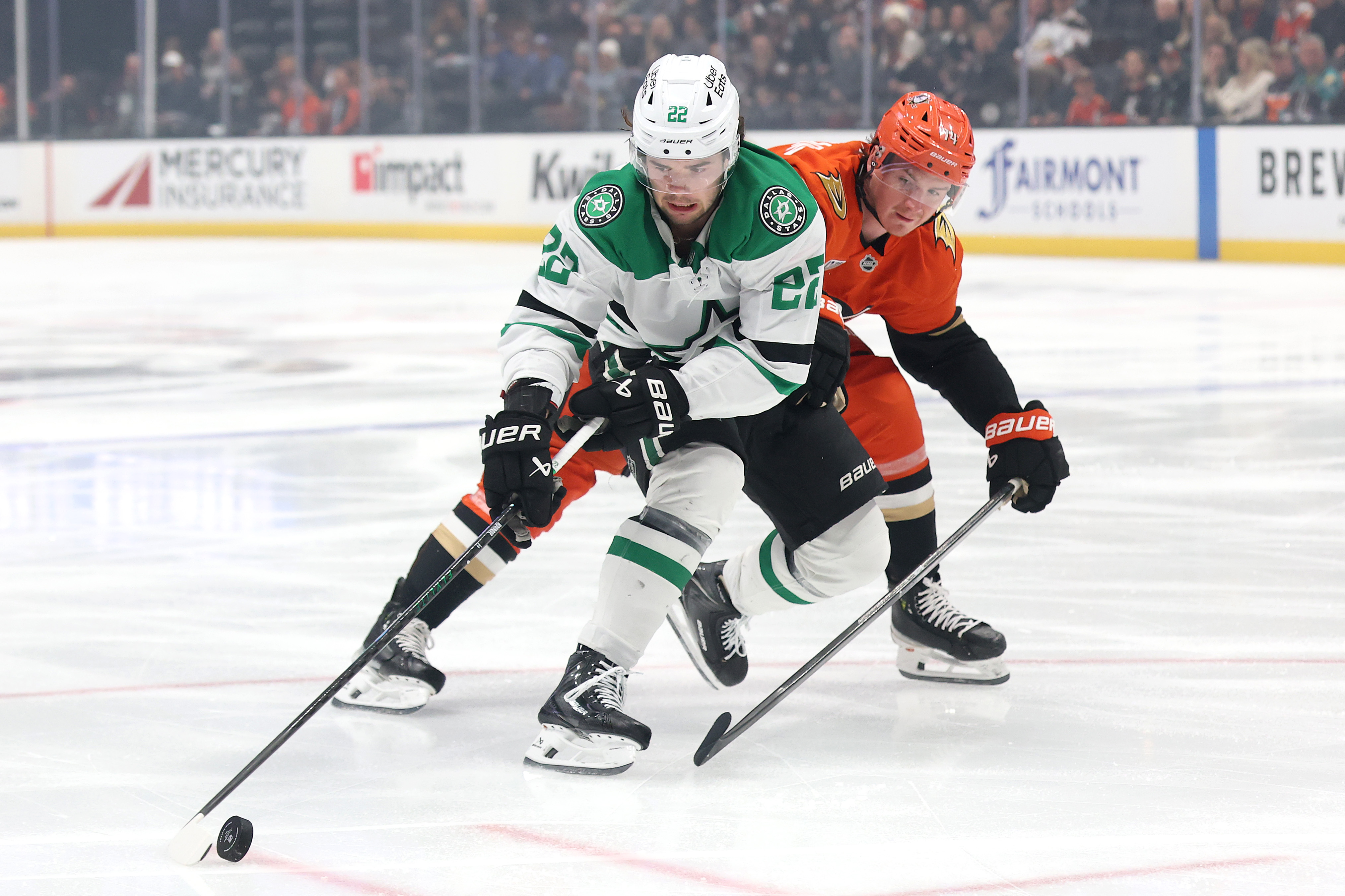 The Dallas Stars’ Mavrik Bourque, left, controls the puck as...