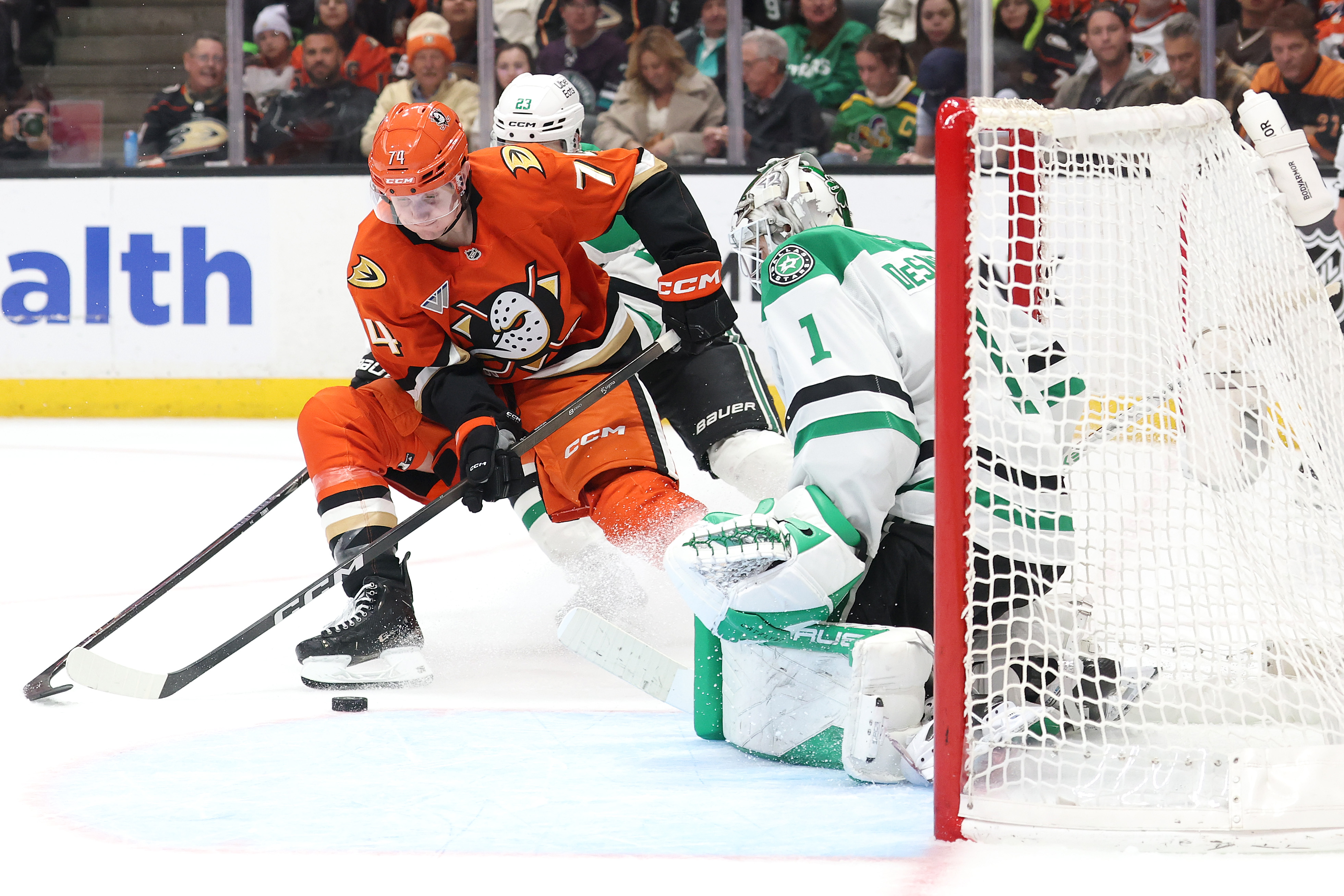 The Ducks’ Ian Moore takes a shot on goal as...