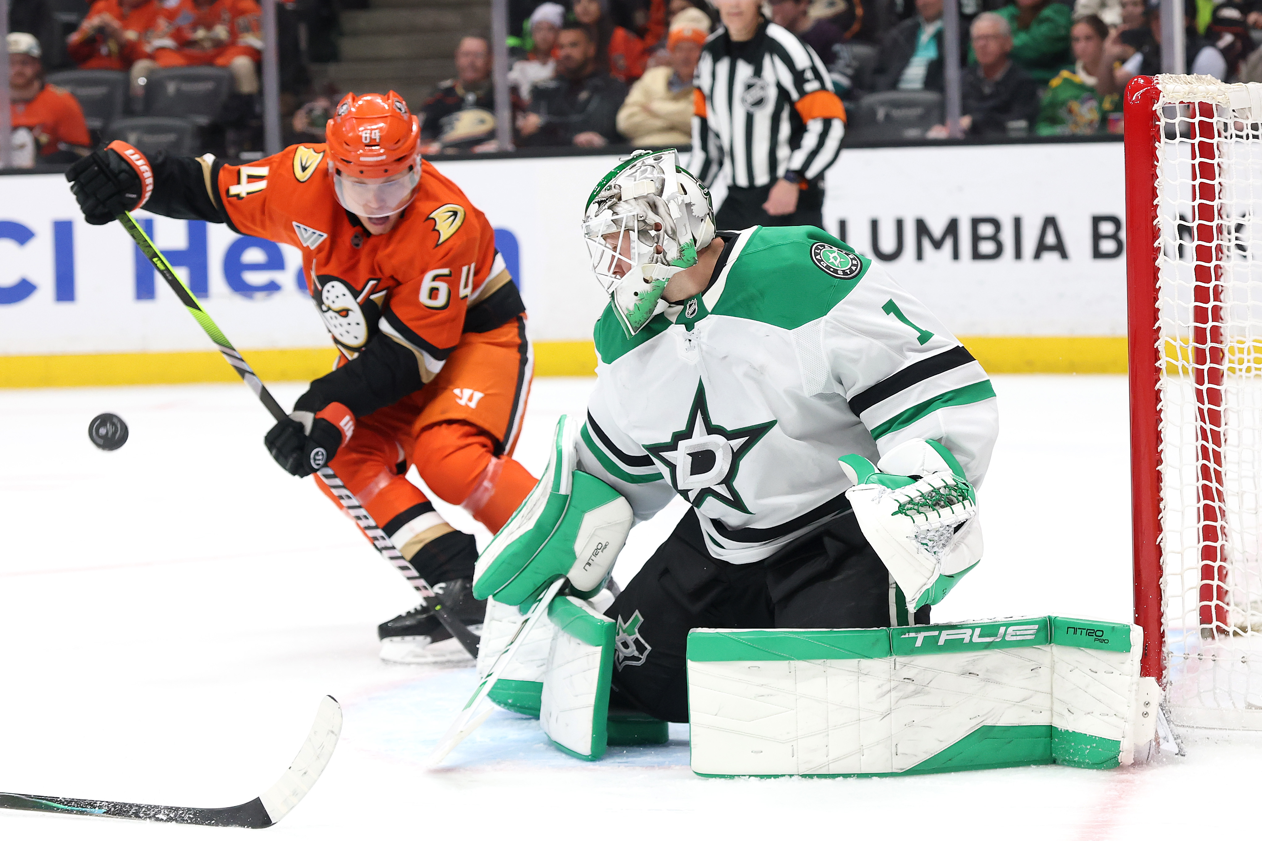 Dallas Stars goaltender Casey DeSmith blocks a shot by the...
