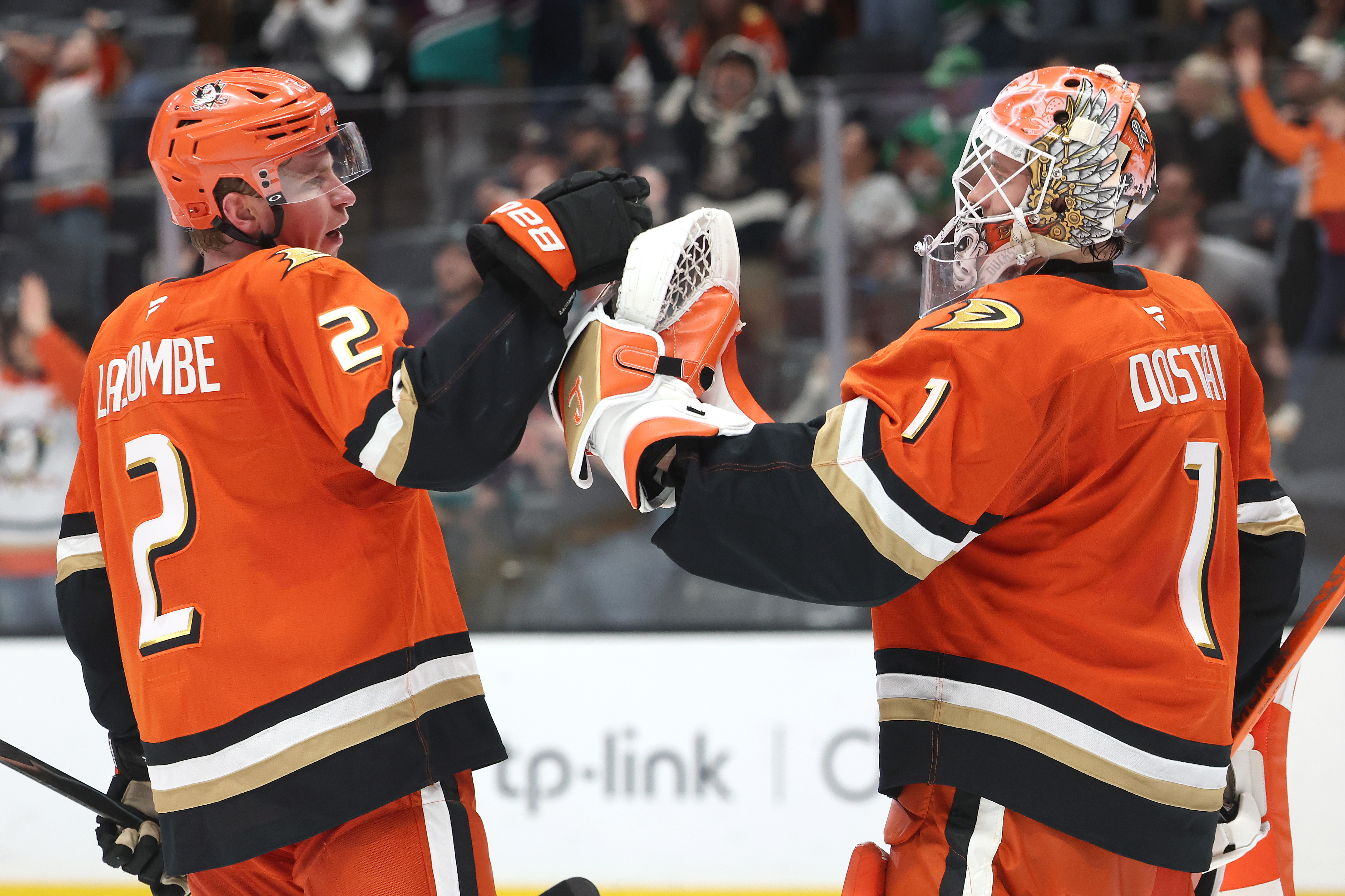The Ducks’ Jackson LaCombe, left, and goaltender Lukas Dostal celebrate...