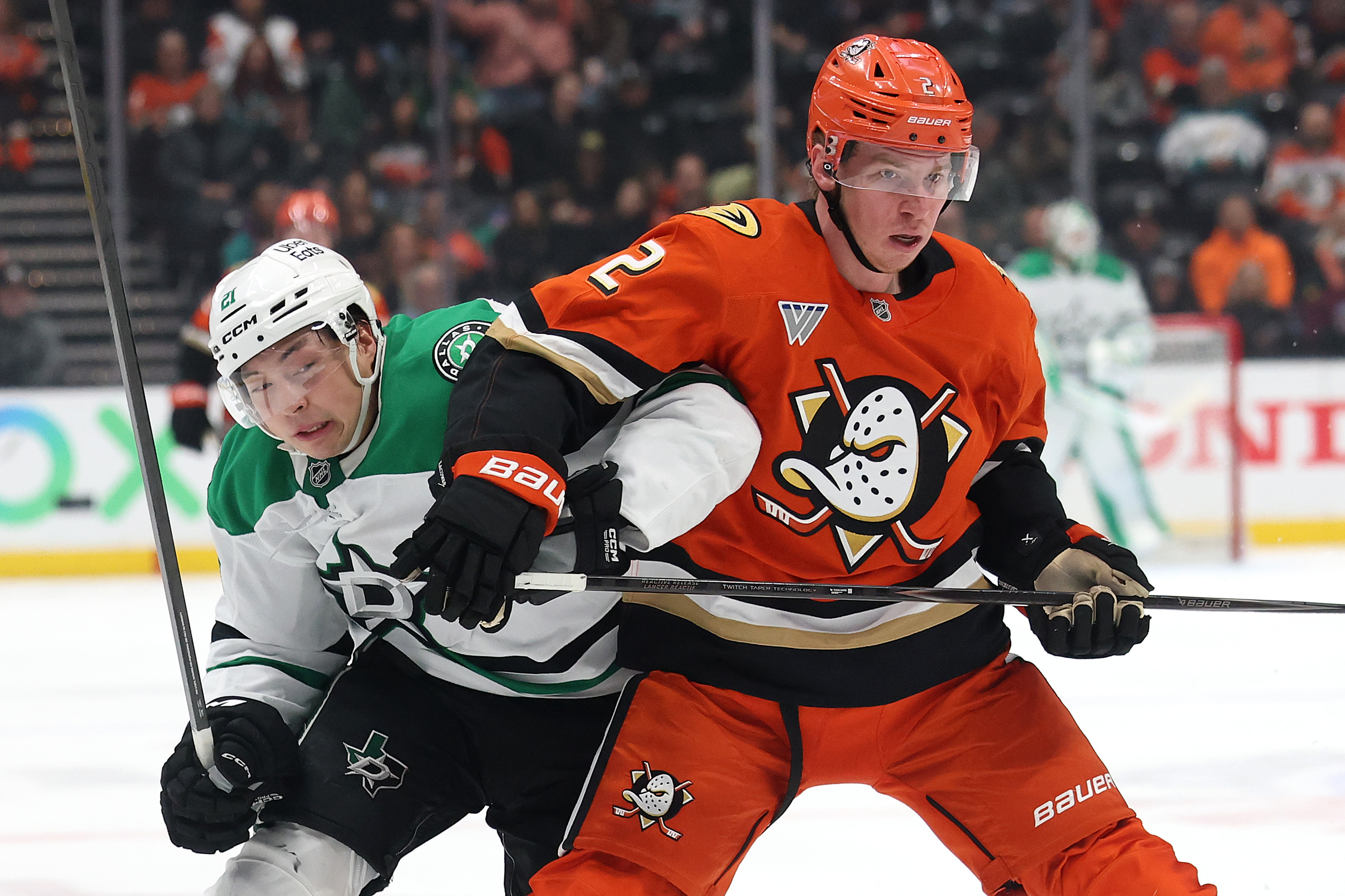 The Dallas Stars’ Jason Robertson, left, and the Ducks’ Jackson...