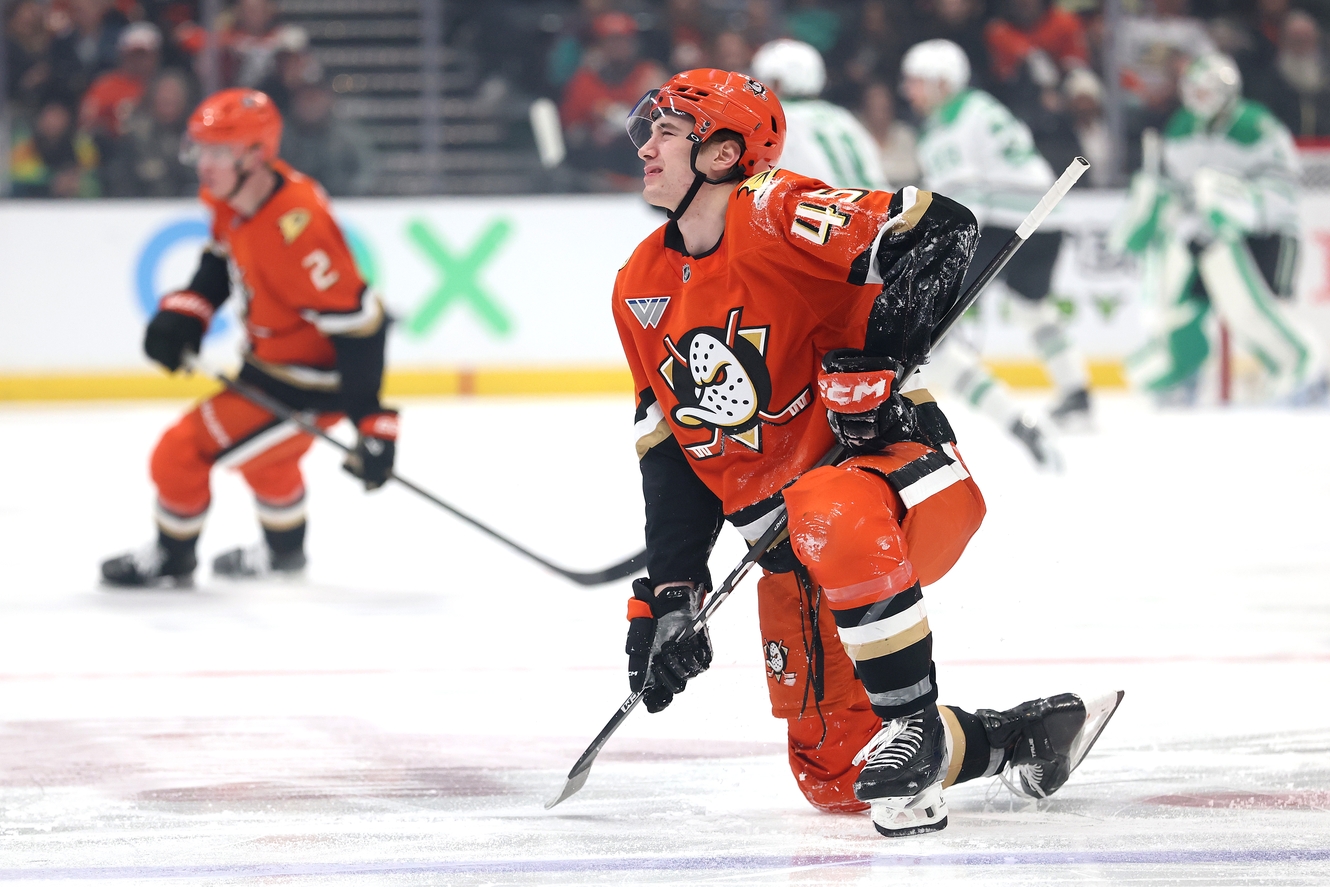 The Ducks’ Beckett Sennecke gets up slowly after a mid-ice...