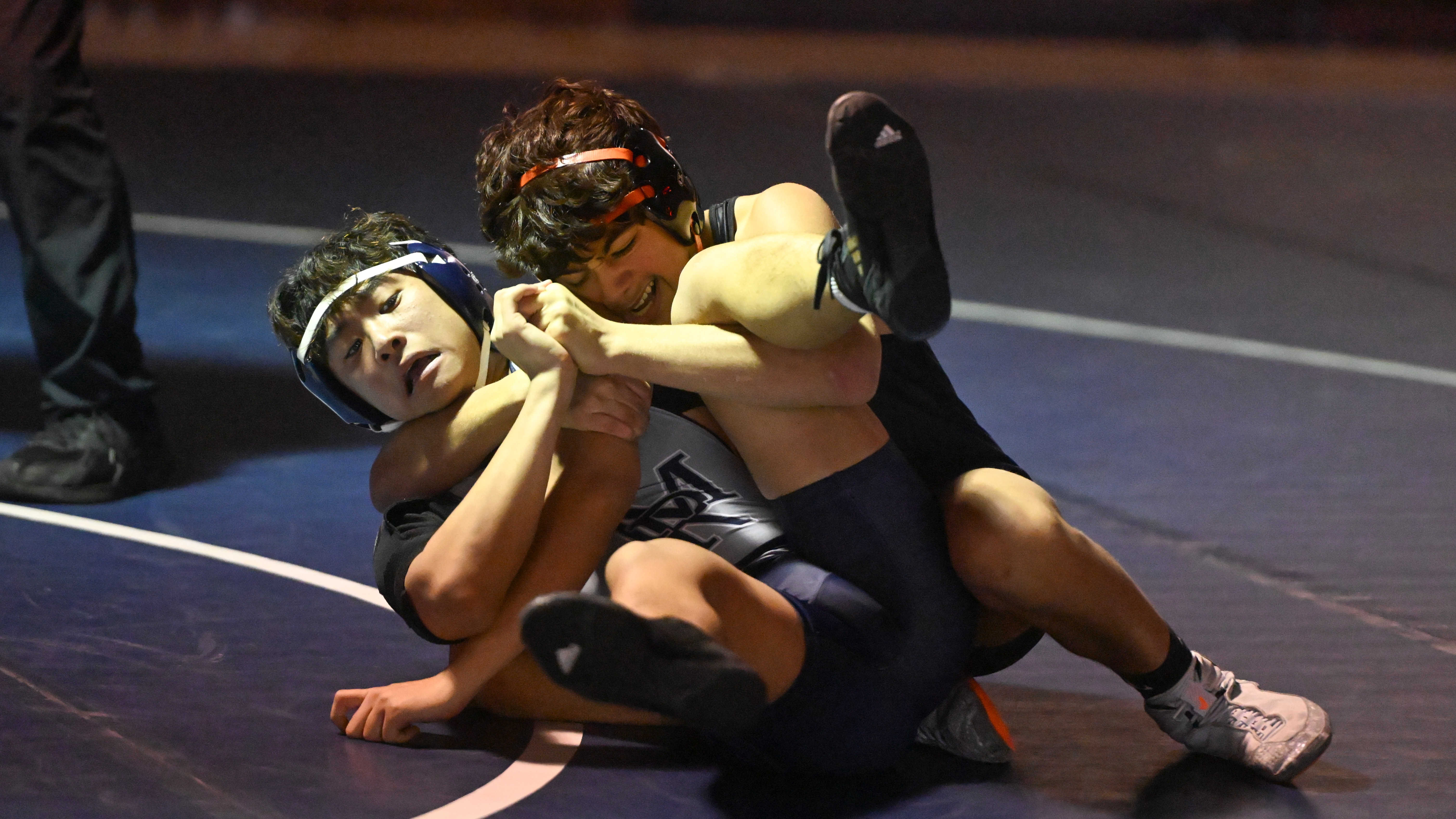 Oakland Mills' Ramon Rodriguez controls Marriotts Ridge's Soochan An in the 132 pound weight class during a wrestling match at Marriotts Ridge High School on Thursday. (Brian Krista/Staff)