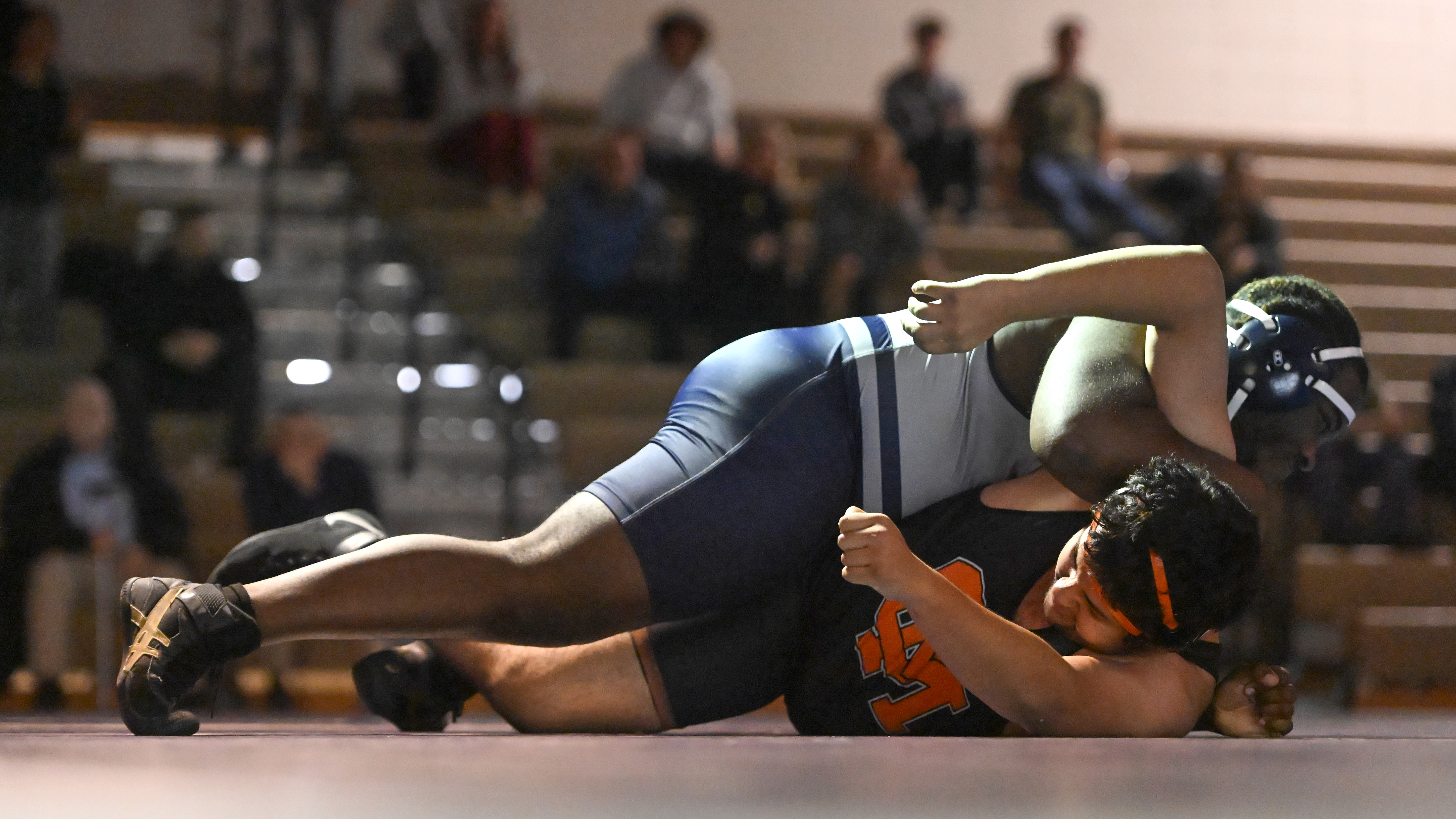 Marriotts Ridge's Akbar Mudasire tries to pin Oakland Mills' Josue "Gabriel" Zelaya-Posada in the 285 pound weight class during a wrestling match at Marriotts Ridge High School on Thursday. (Brian Krista/Staff)