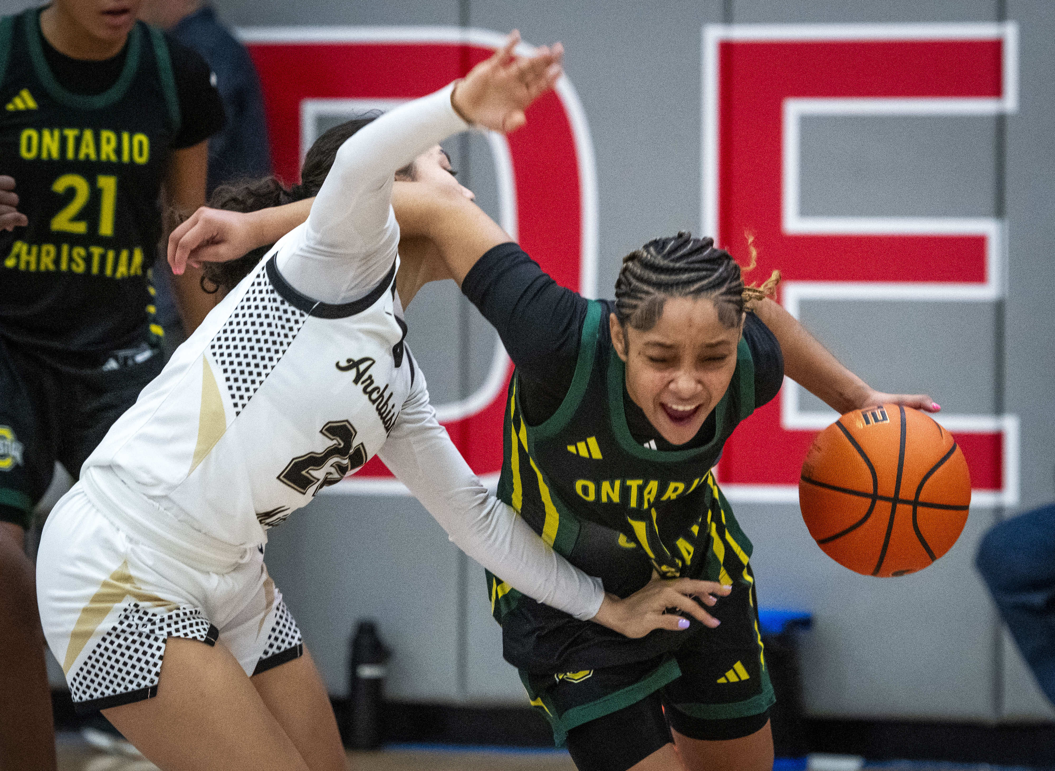 Ontario Christian’s Kaleena Smith (11) brings the ball up court...