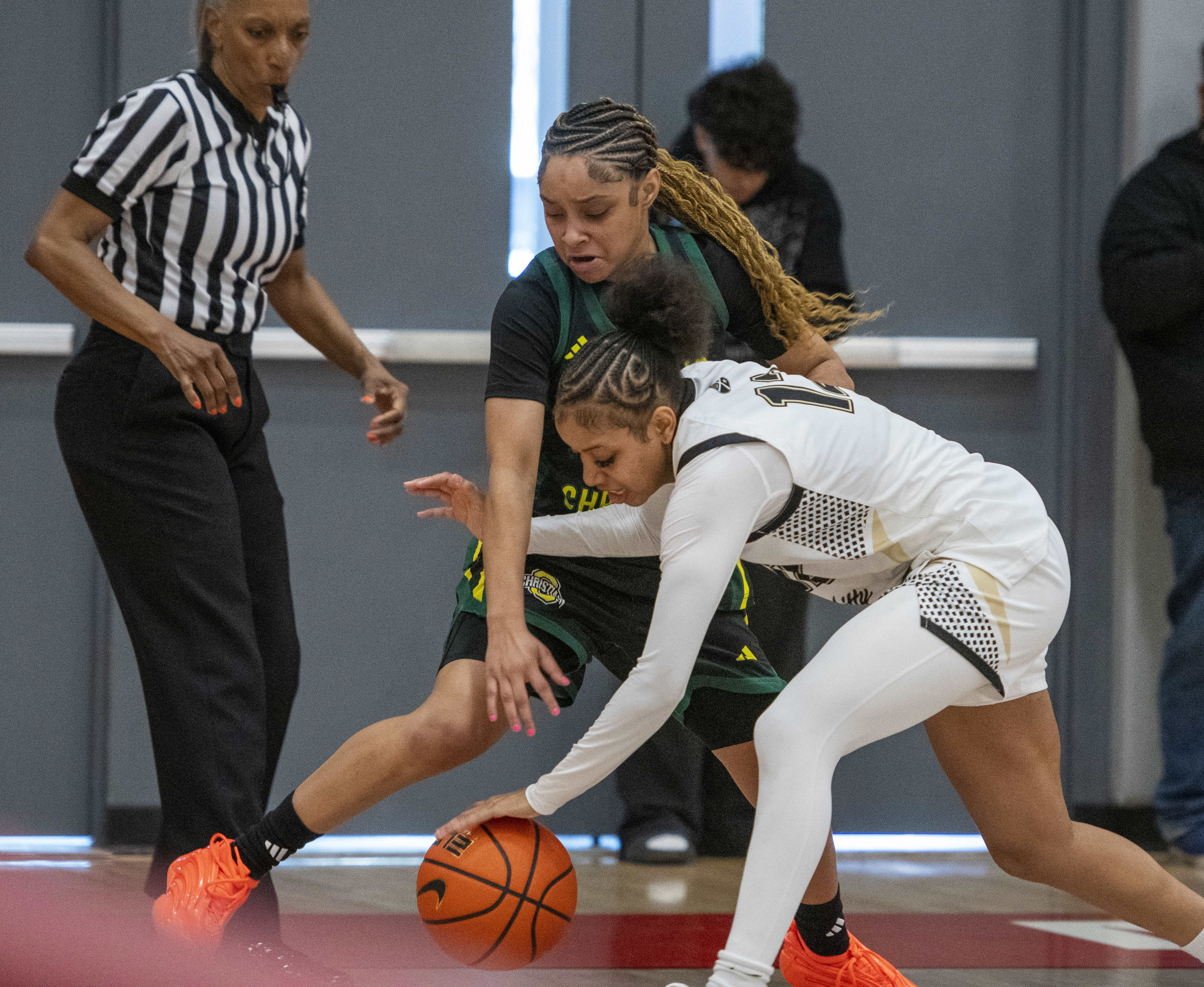 Ontario Christian’s Kaleena Smith (11) forces Archbishop Mitty’s Tee McCarthy...