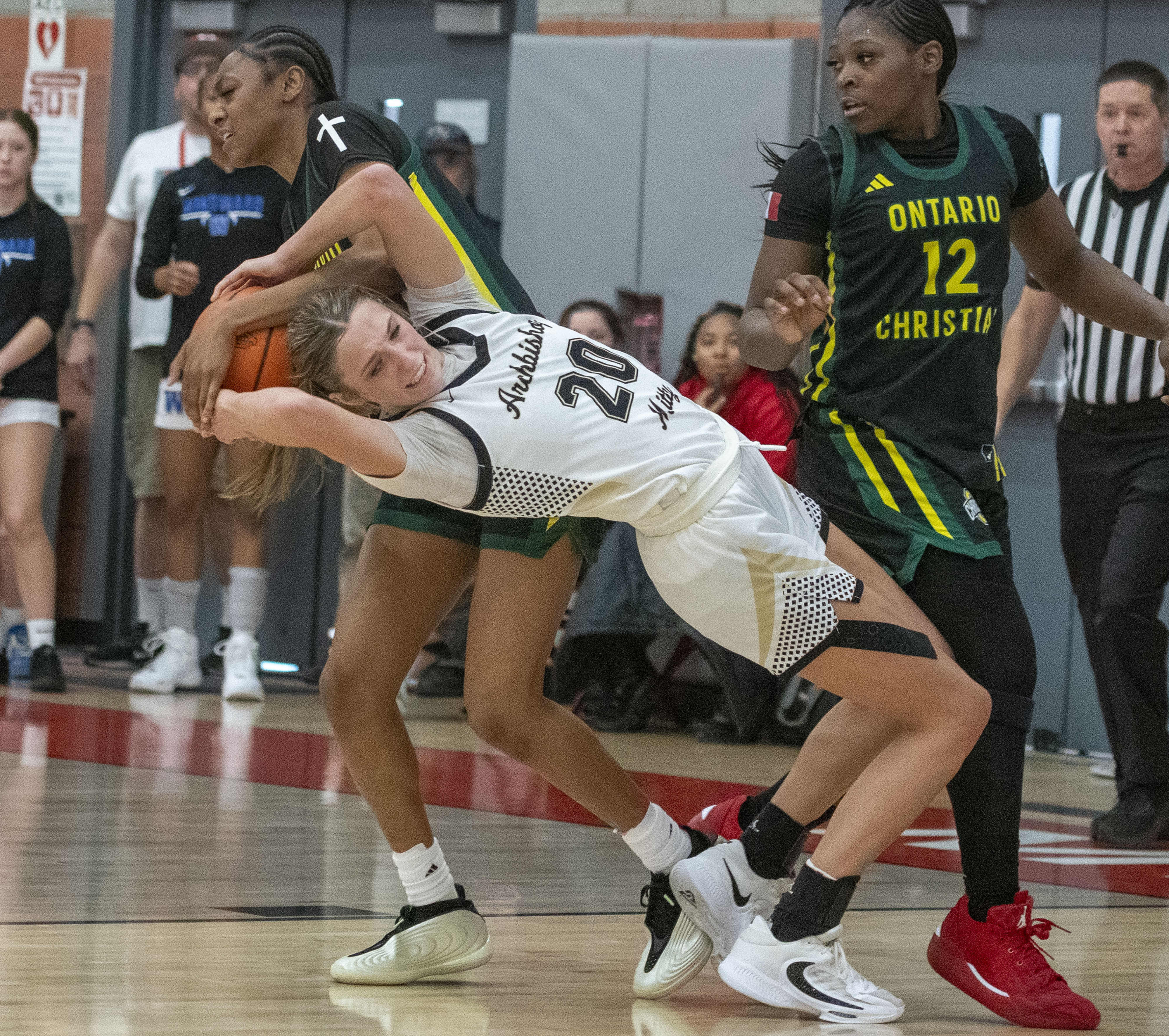 Ontario Christian’s Layia King (15) fouls Archbishop Mitty’s McKenna Woliczko...