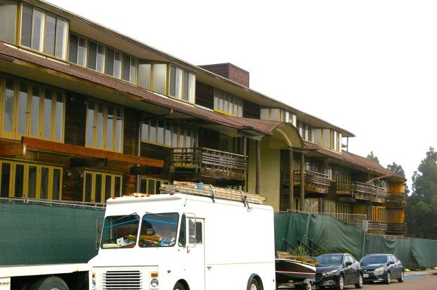 The property at 2828 Upshur St. in Point Loma, formerly known as the Imperial House apartments, is surrounded by a construction fence. (Tyler Faurot)