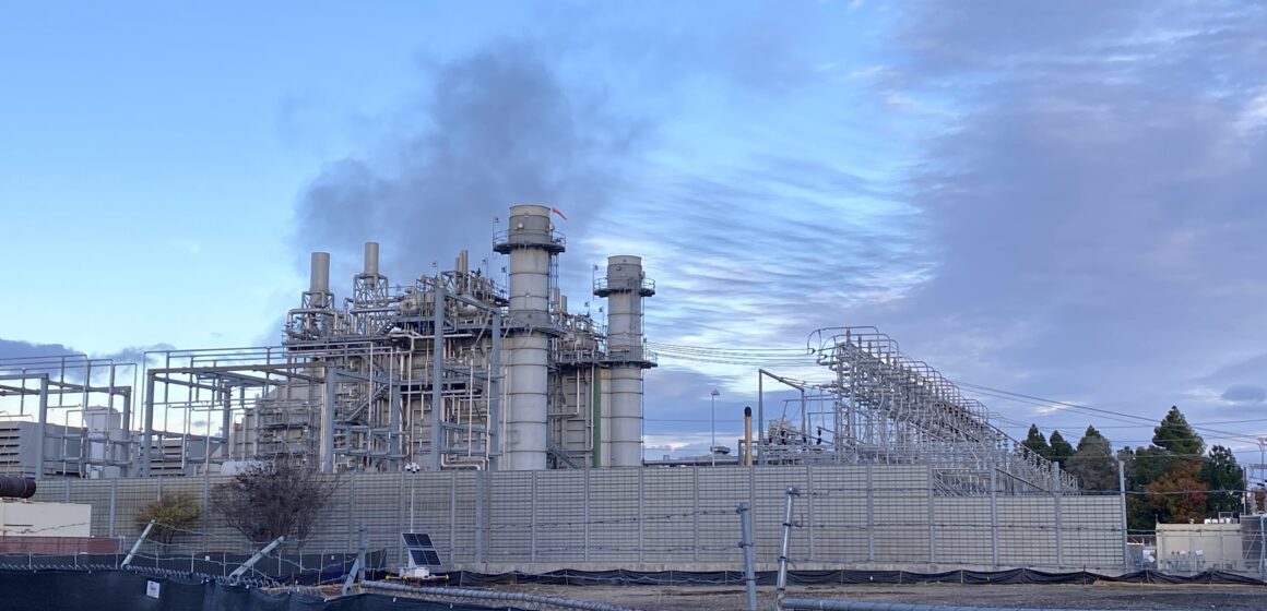 Electricity power plant with smoke coming from burning stacks