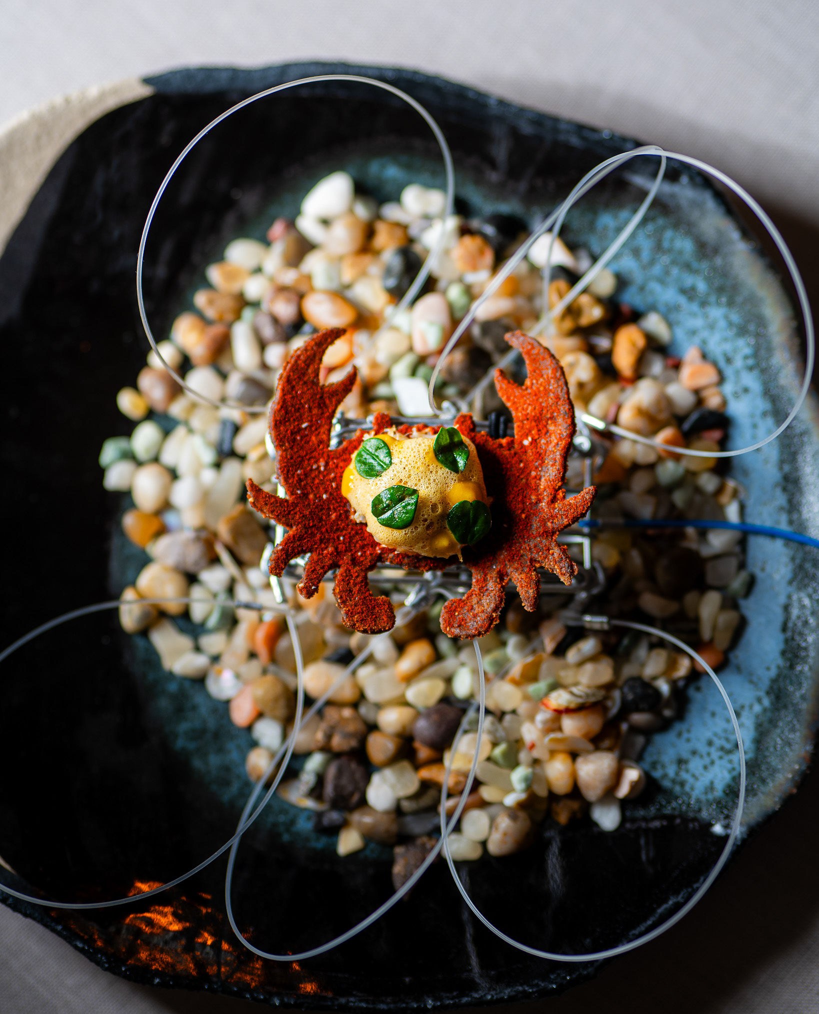 A bite of food on a cracker made to look like Dungeness crab at Vicinity in Los Gatos.