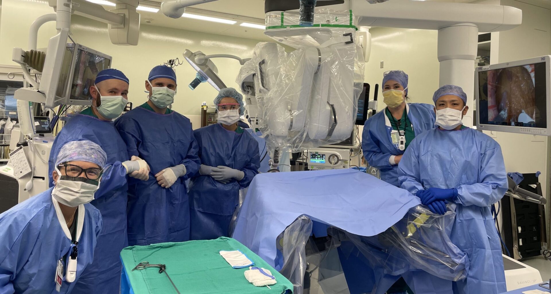 Surgical team stands in scrubs in a hospital operating room