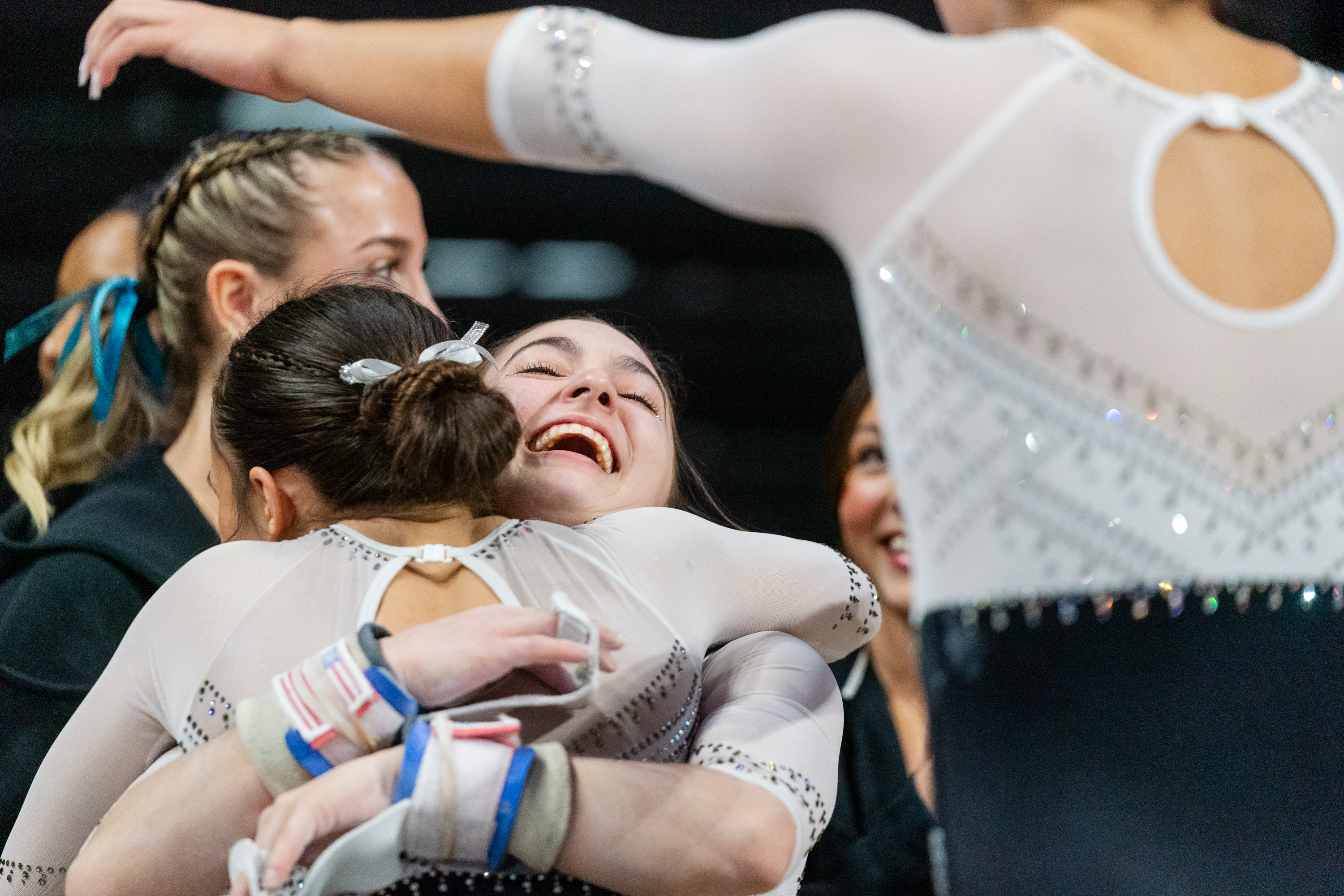 Ellie Weaver of the Oregon State Beavers gets a hug after competing on the uneven bars during a gymnastics meet against the Sacramento State Hornets at Gill Coliseum on January 16, 2026 in Corvallis, OR.
