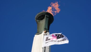 The Olympic cauldron is lit at the Los Angeles Memorial Coliseum ahead of the launch for ticket registration to the 2028 Summer Olympic Games Tuesday, Jan. 13, 2026, in Los Angeles. (AP Photo/Damian Dovarganes)