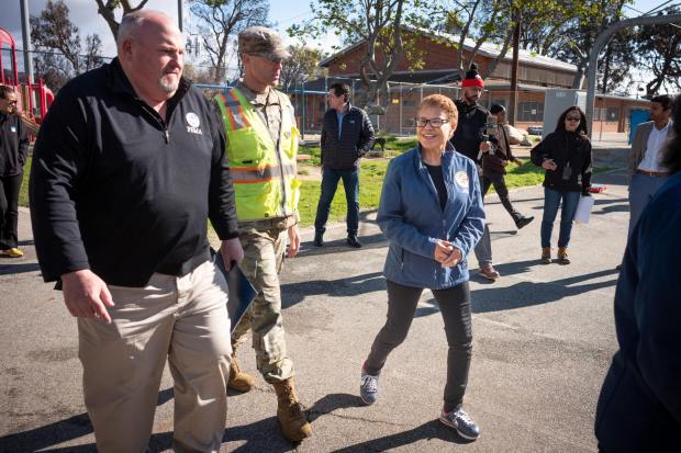 Los Angeles Mayor Karen Bass, right, arrives to a press conference in the Palisades with FEMA regional Director Bob Fenton, left, and Col Eric Swenson of the Army Corps of Engineers on Thursday, March 6, 2025. Bass announced that the DWP has approved tap water to be used again in the Palisades area. (Photo by David Crane, Los Angeles Daily News/SCNG)