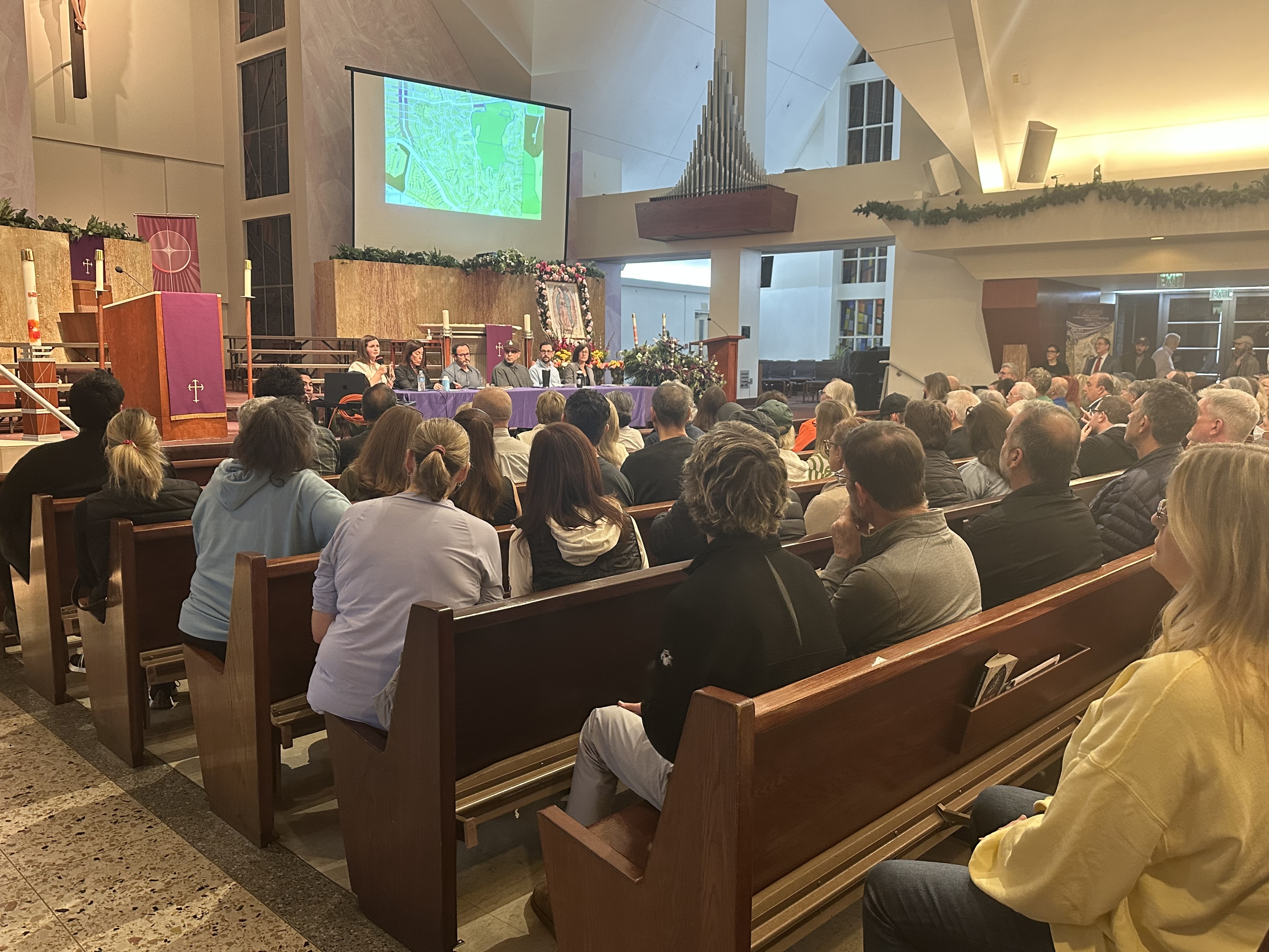 Nearly 700 residents packed St. Mel Catholic Church on Dec....