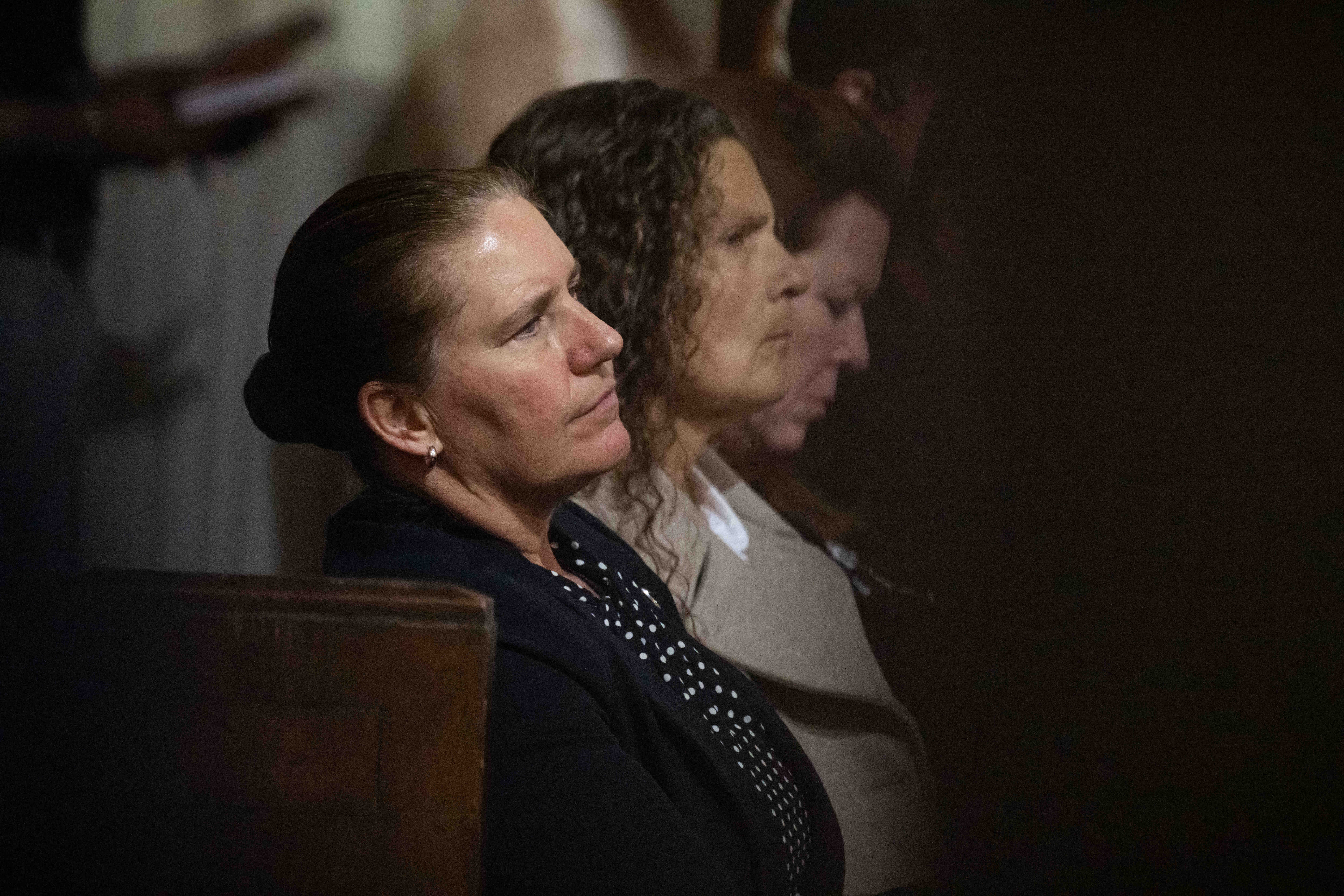 Former LAFD Fire Chief Kristin Crowley sits with her wife,...