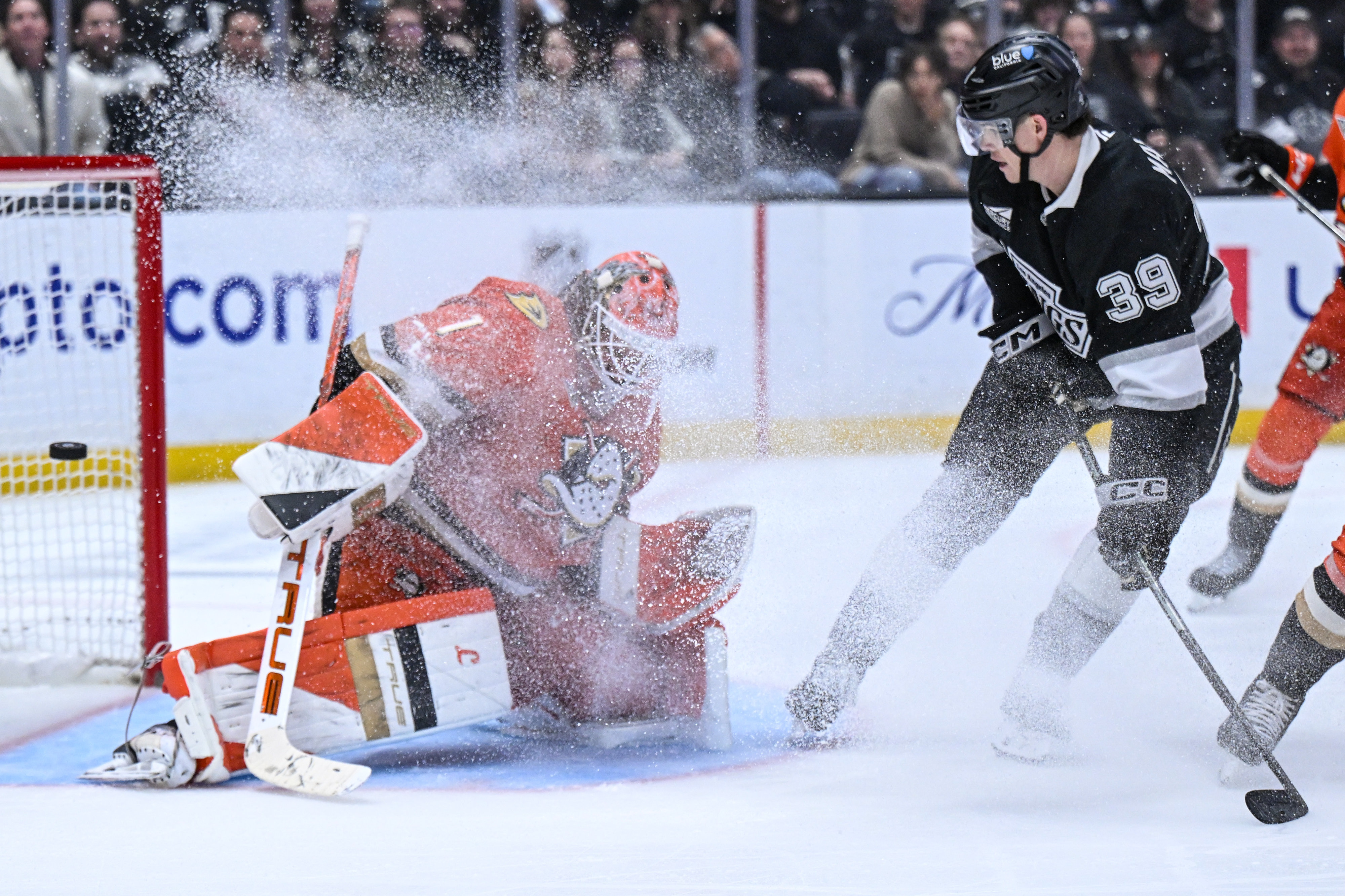 The Kings’ Jeff Malottâs (39) has his shot deflected by...
