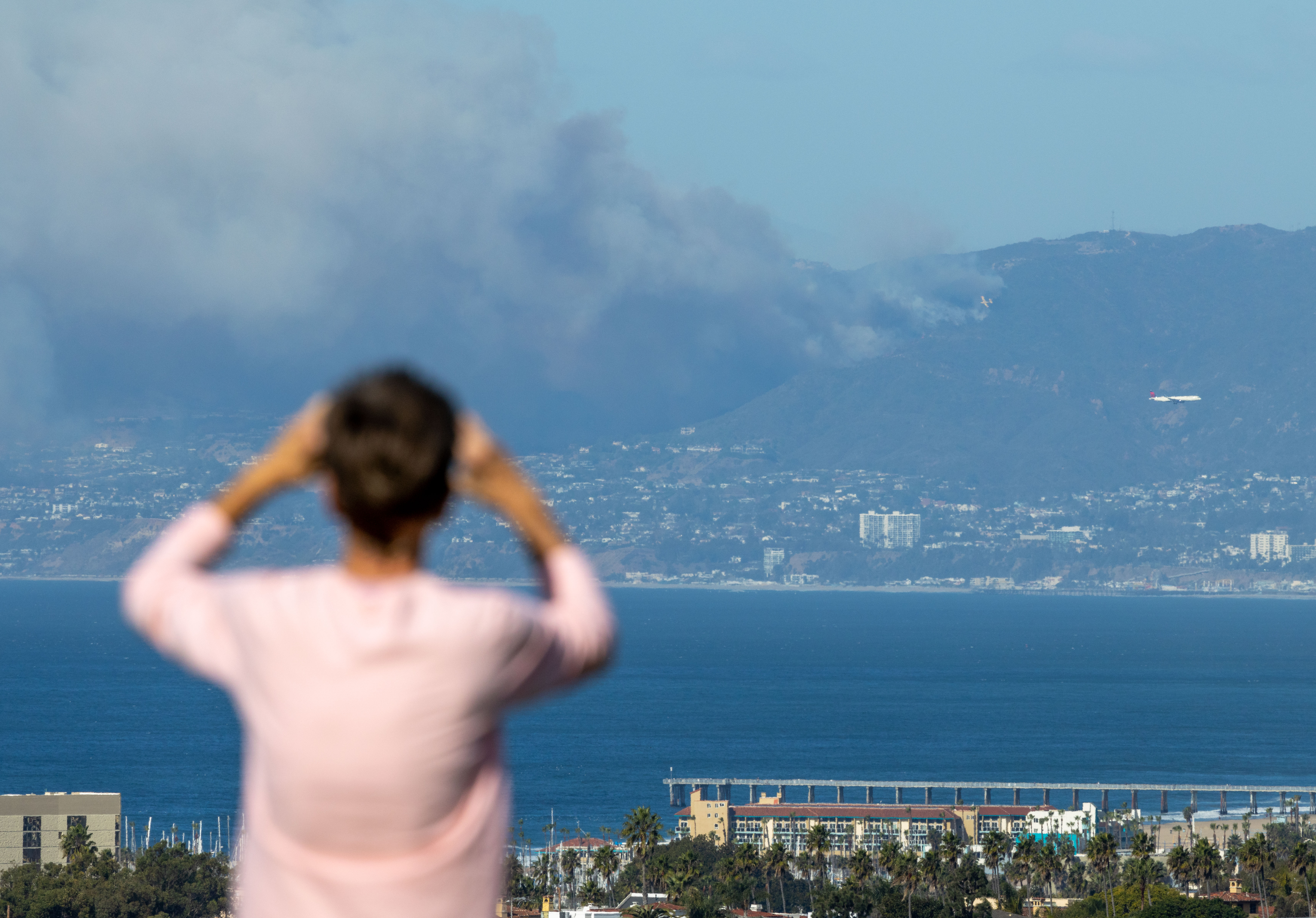 A fast-moving fire fueled by heavy winds and brush moved...