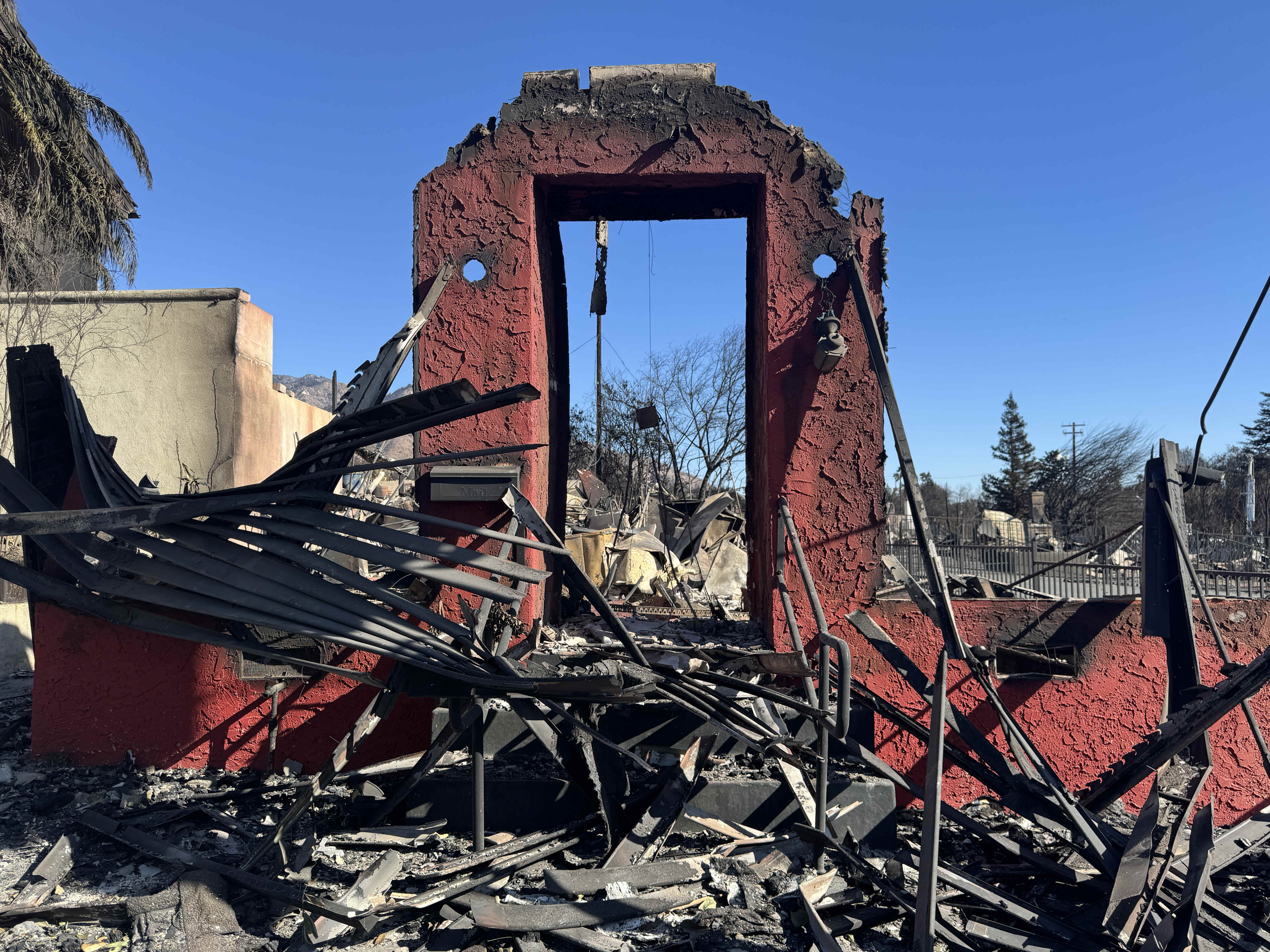 A destroyed building can be seen along Lake Avenue in...