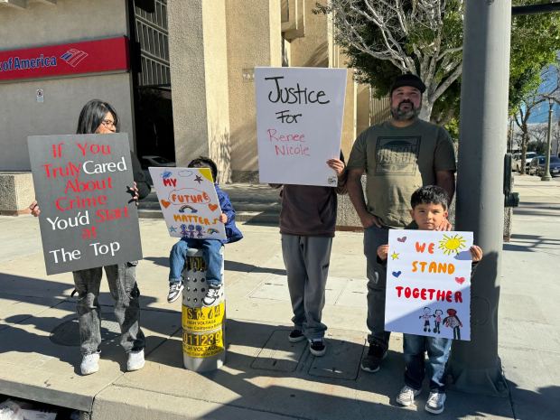 Beaumont residents, from left, Deysi Reyes, Domic, Jordan, Darin and Daxton protest at the intersection of Third and D streets Saturday, Jan. 10. The group gathered in response to an Immigration and Customs Enforcement officer's fatal shooting of Renee Good, 37, of Minneapolis. (Photo by Israel J. Carreón Jr., The San Bernardino Sun/SCNG)