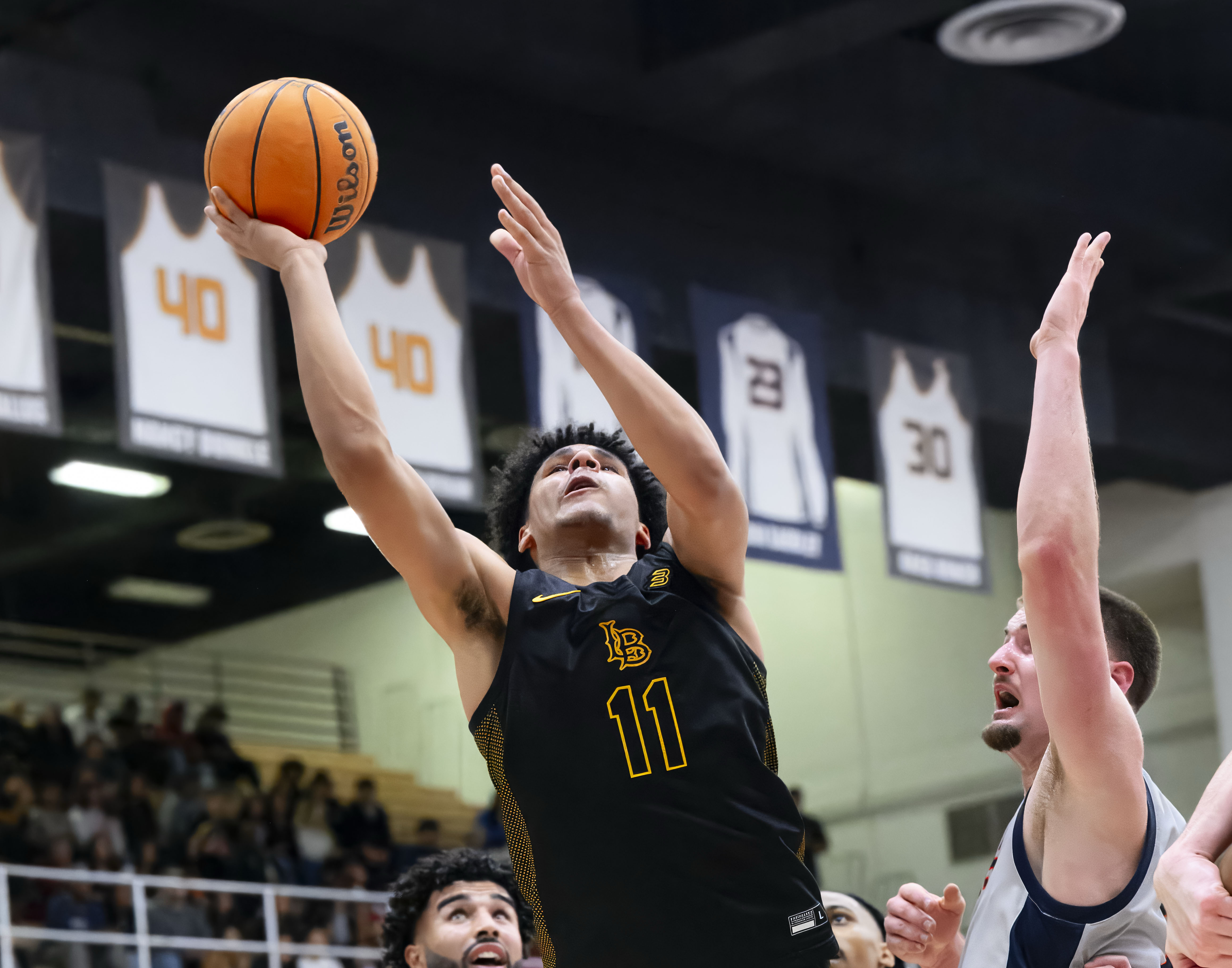 Long Beach State guard Gavin Sykes puts up a shot...