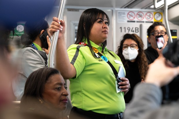 Metro Ambassador Jennifer Sory rides with passengers on the L line metro train on Monday, March 6, 2023. 300 new Metro Transit Ambassadors will serve as greeters and be eyes and ears for problems and trouble on trains and buses for Metro is now in service across the metro platforms. Metro hopes the new ambassador program will increase rider safety and comfort. (Photo by David Crane, Los Angeles Daily News/SCNG)
