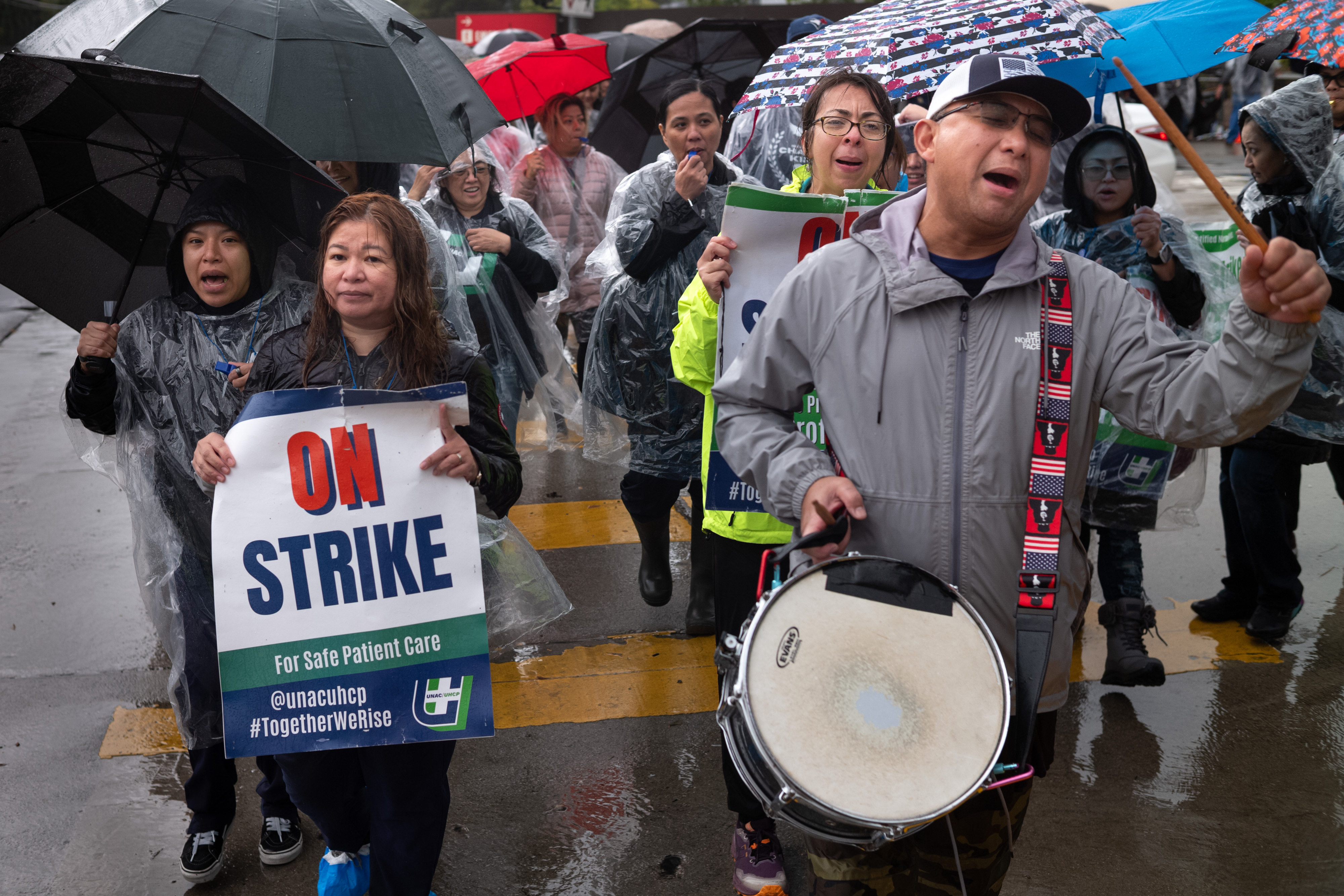 Hundreds of nurses and staff picket outside of the Kaiser...