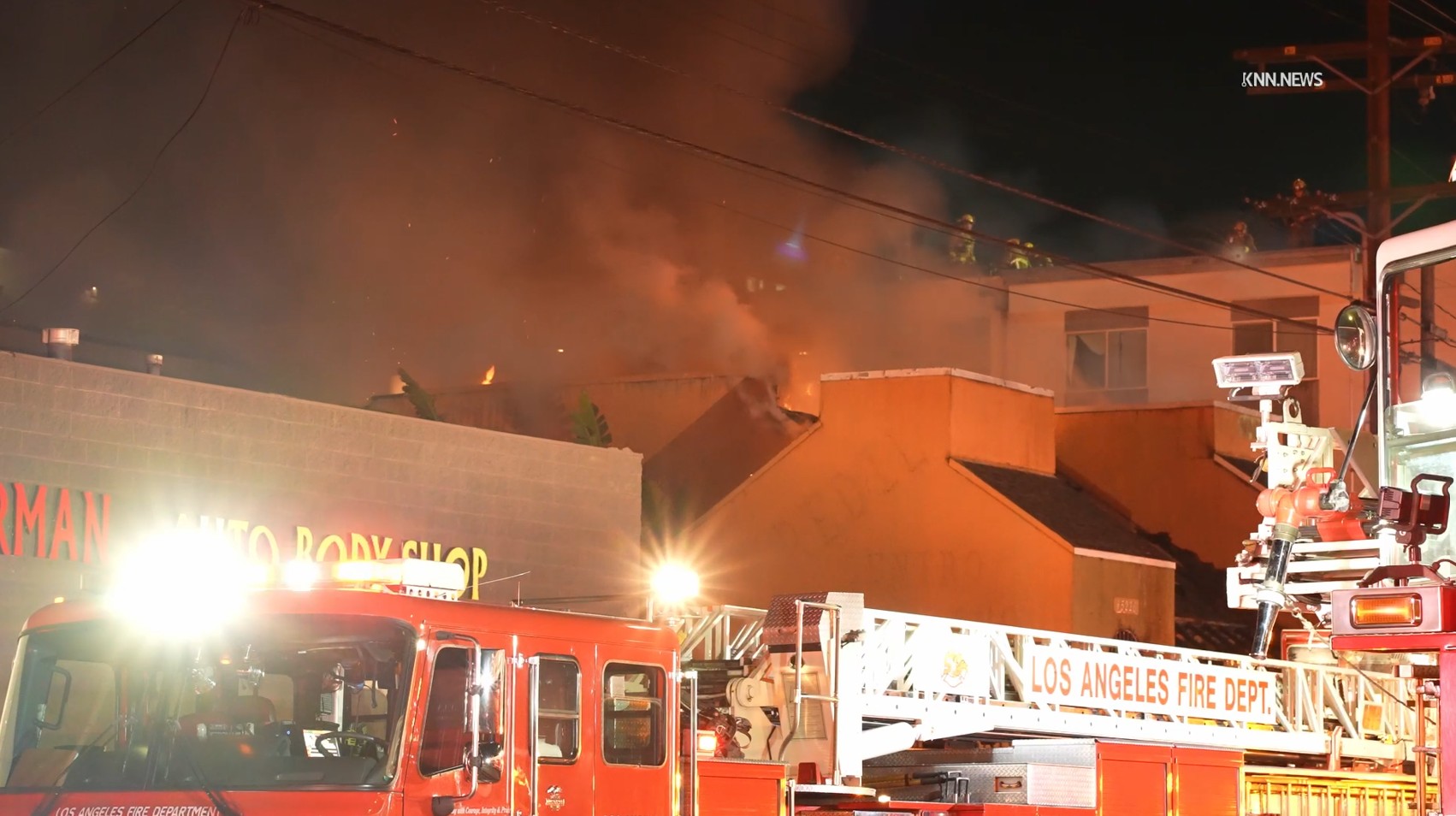 Los Angeles firefighters battle a major emergency fire on Tuesday,...