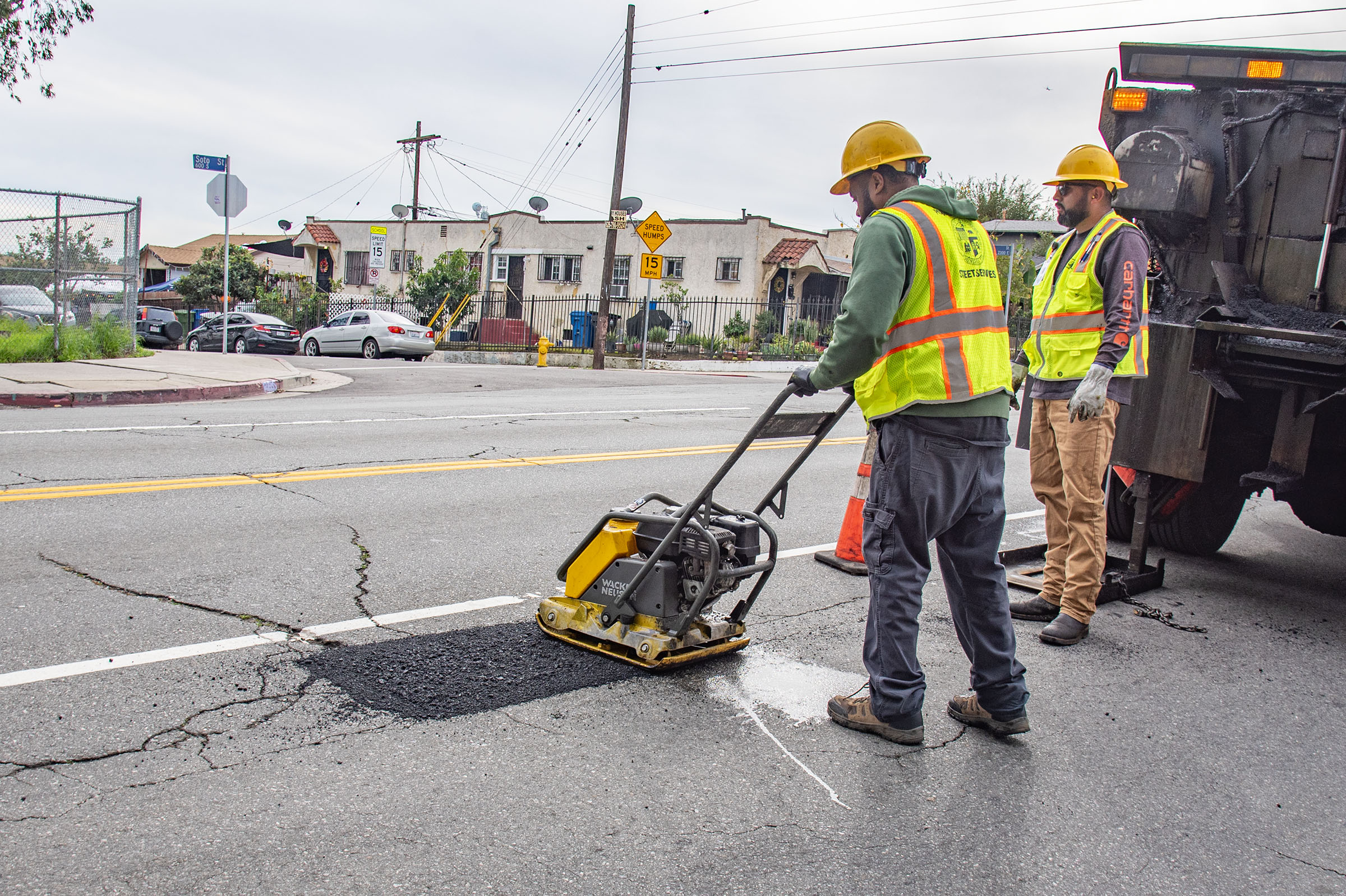 LA city workers repair potholes after a series of rainstorms...