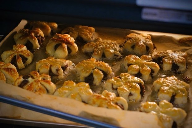 Chinese peach blossom pastries enter the oven at Lotus Bridge's first general meeting. (Qianqian Yang)