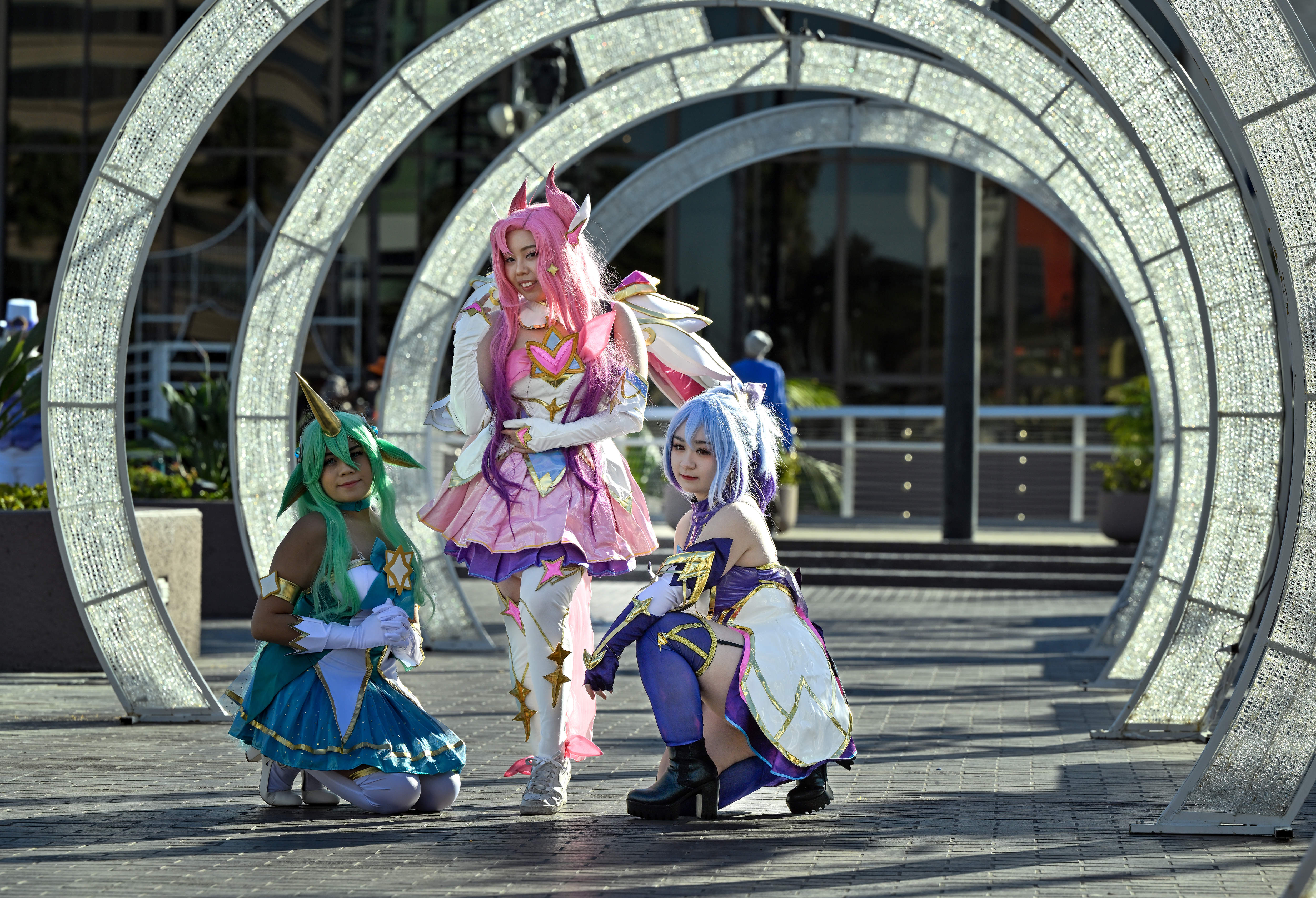 Cosplayers dressed as characters from League of Legends, a multiplayer...