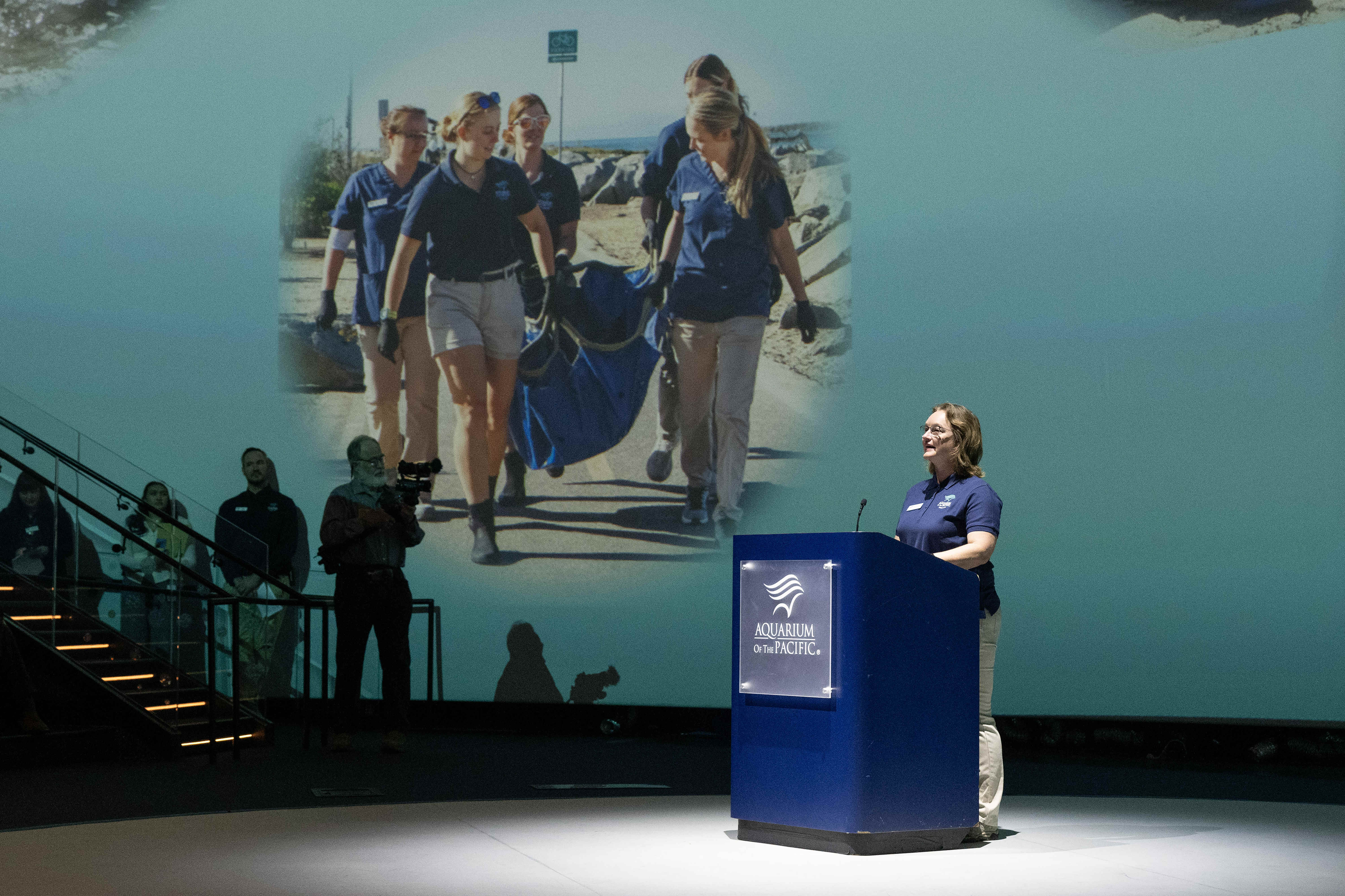 Volunteer Services Director Cassandra Davis speaks during the grand opening...