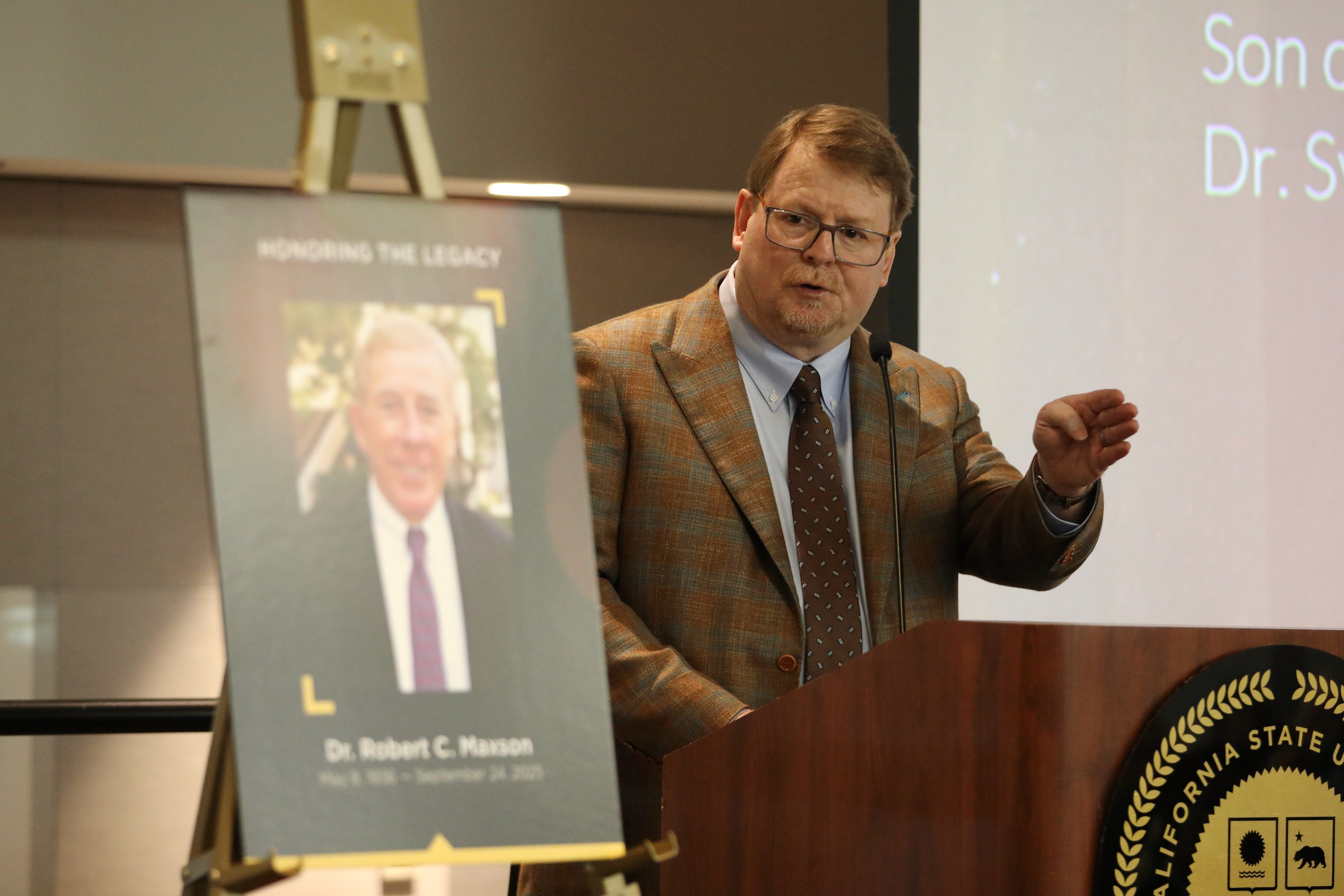 Dr. Todd Maxson, son of Dr. Robert Maxson, honors his...