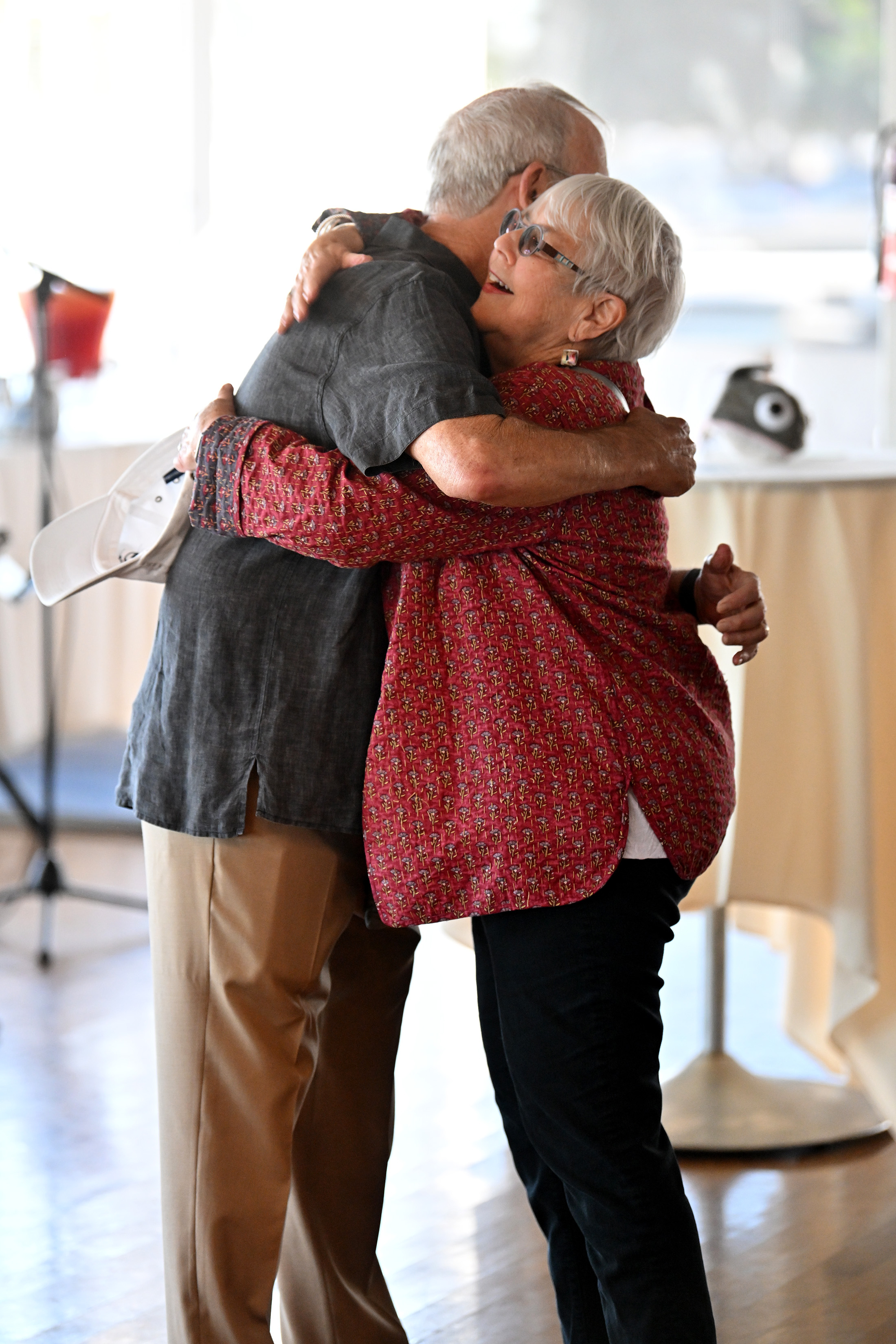 Bonnie Lowenthal, educator and former California State Assemblywoman, hugs Dr....