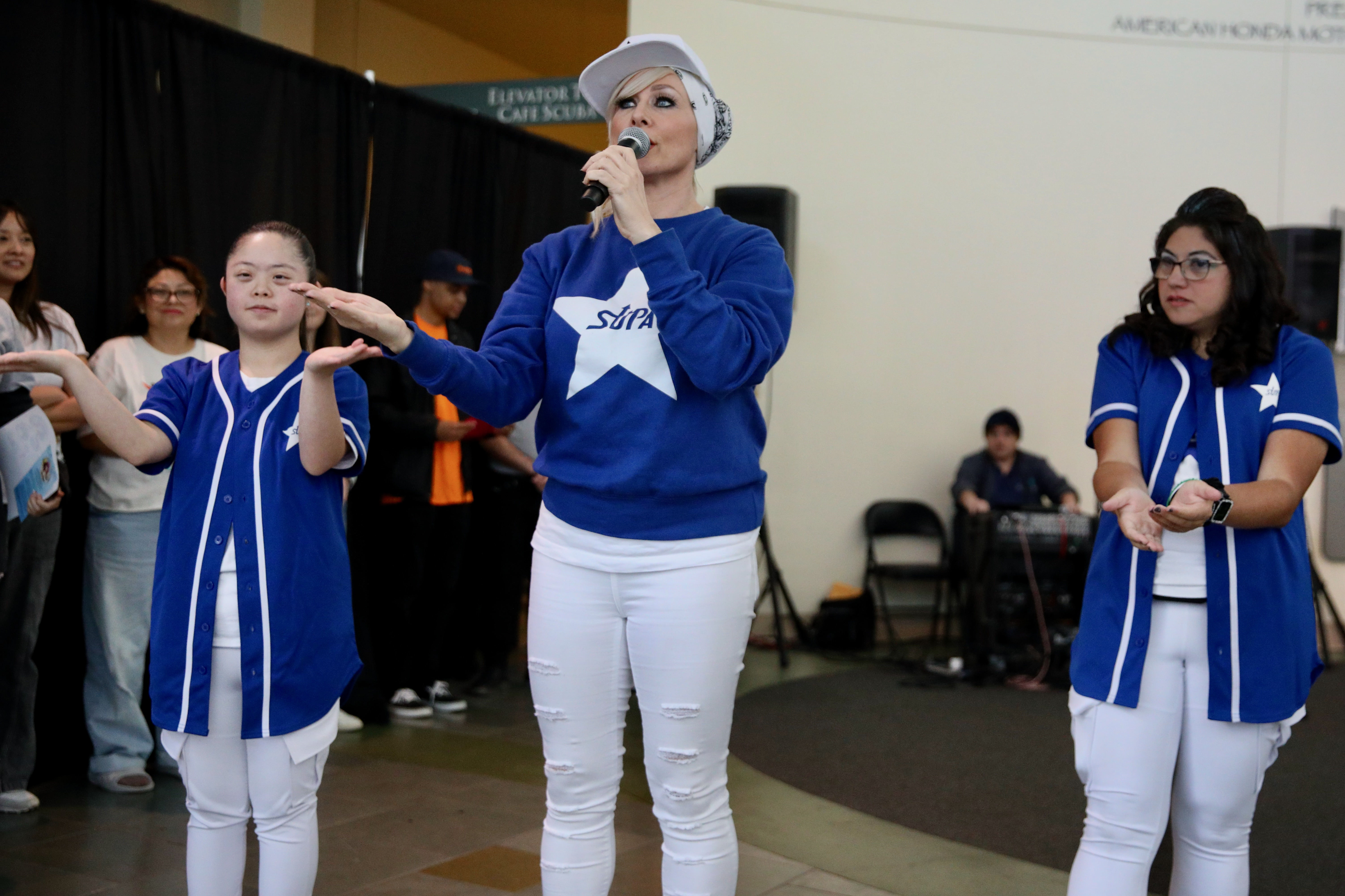 American Sign Language performers Michelle Kim, from left, Robin Olive...