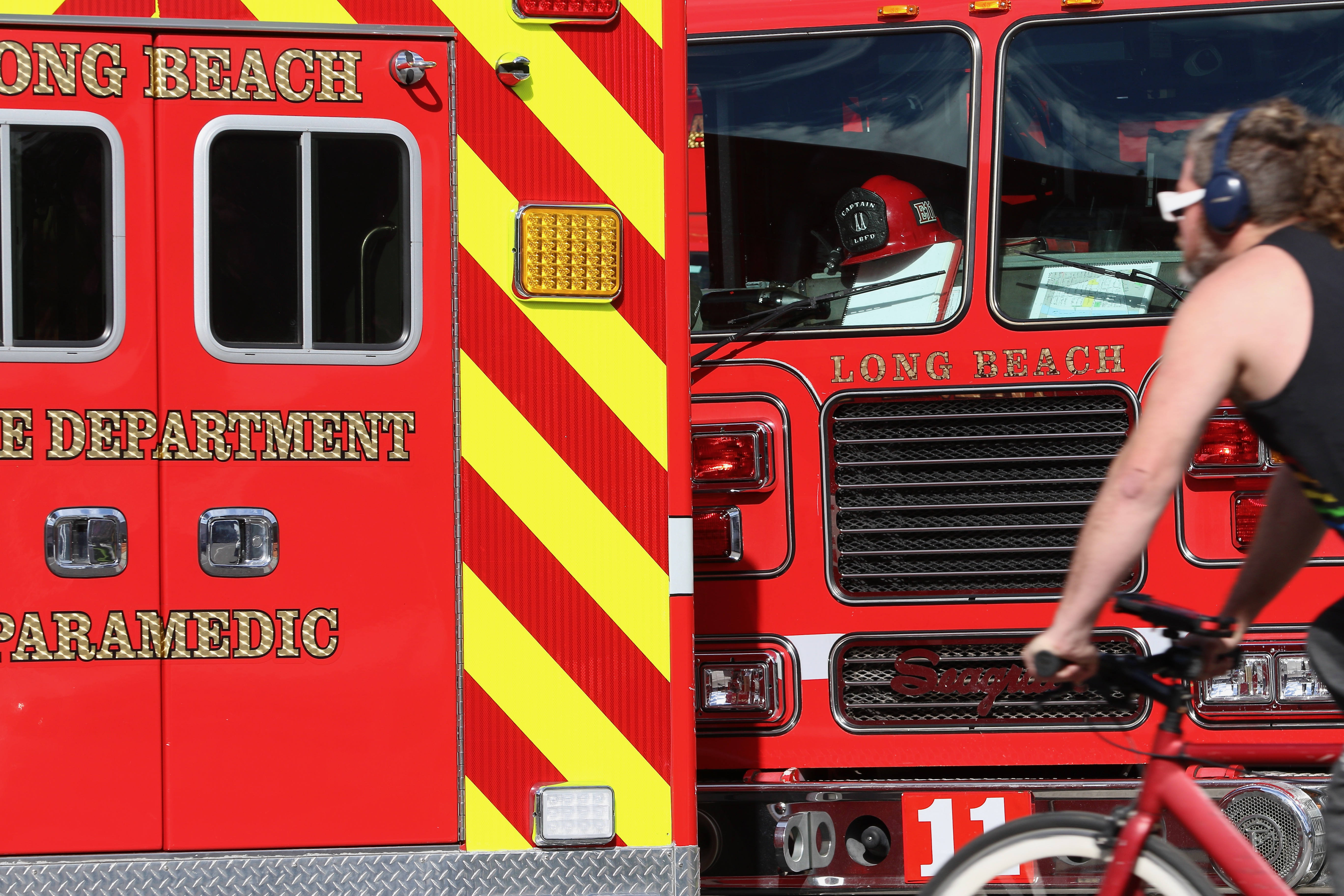 A bicyclist passes Long Beach Fire Station 2 on Monday,...