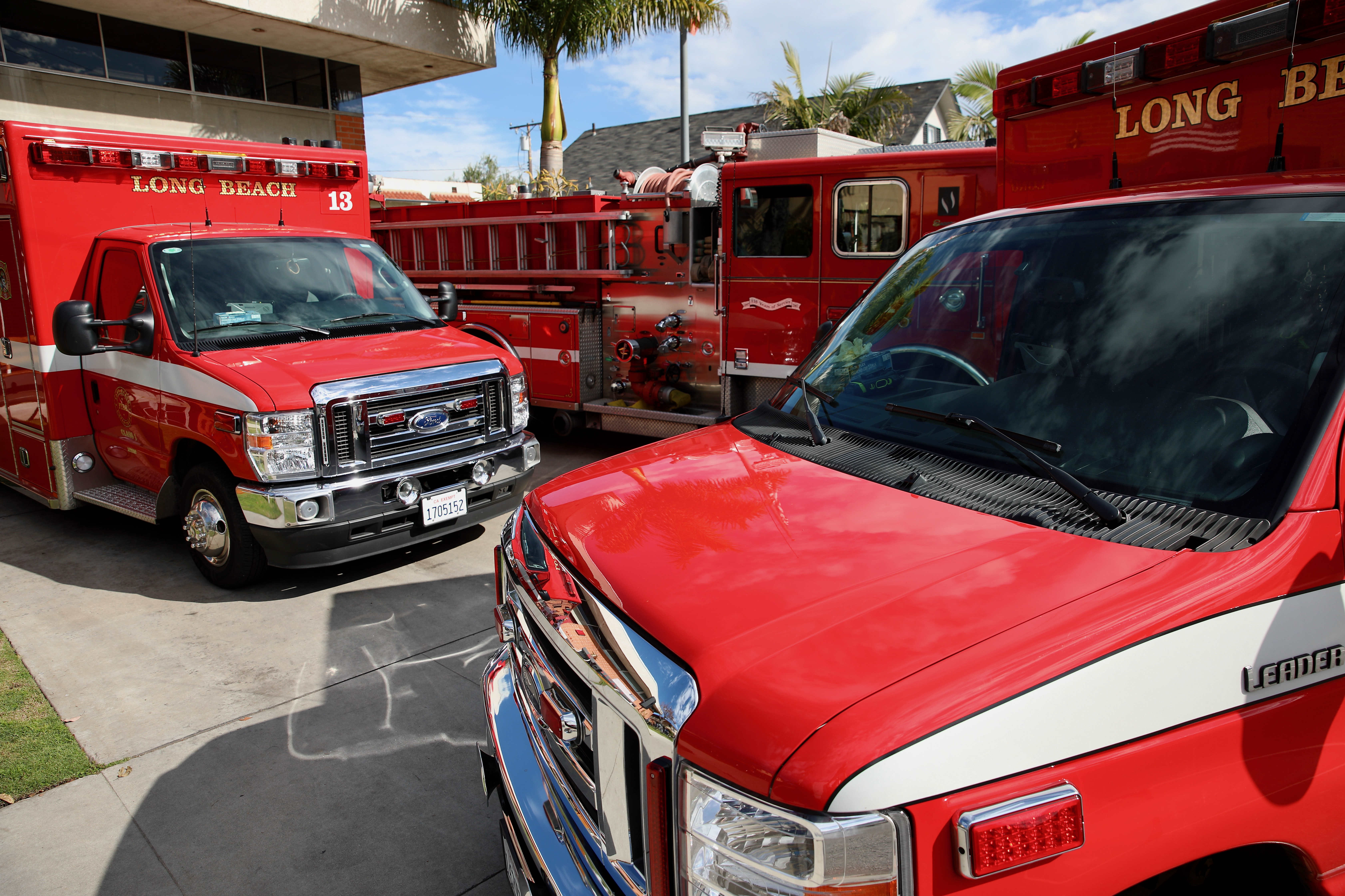 Long Beach Fire Department vehicles are positioned at Fire Station...