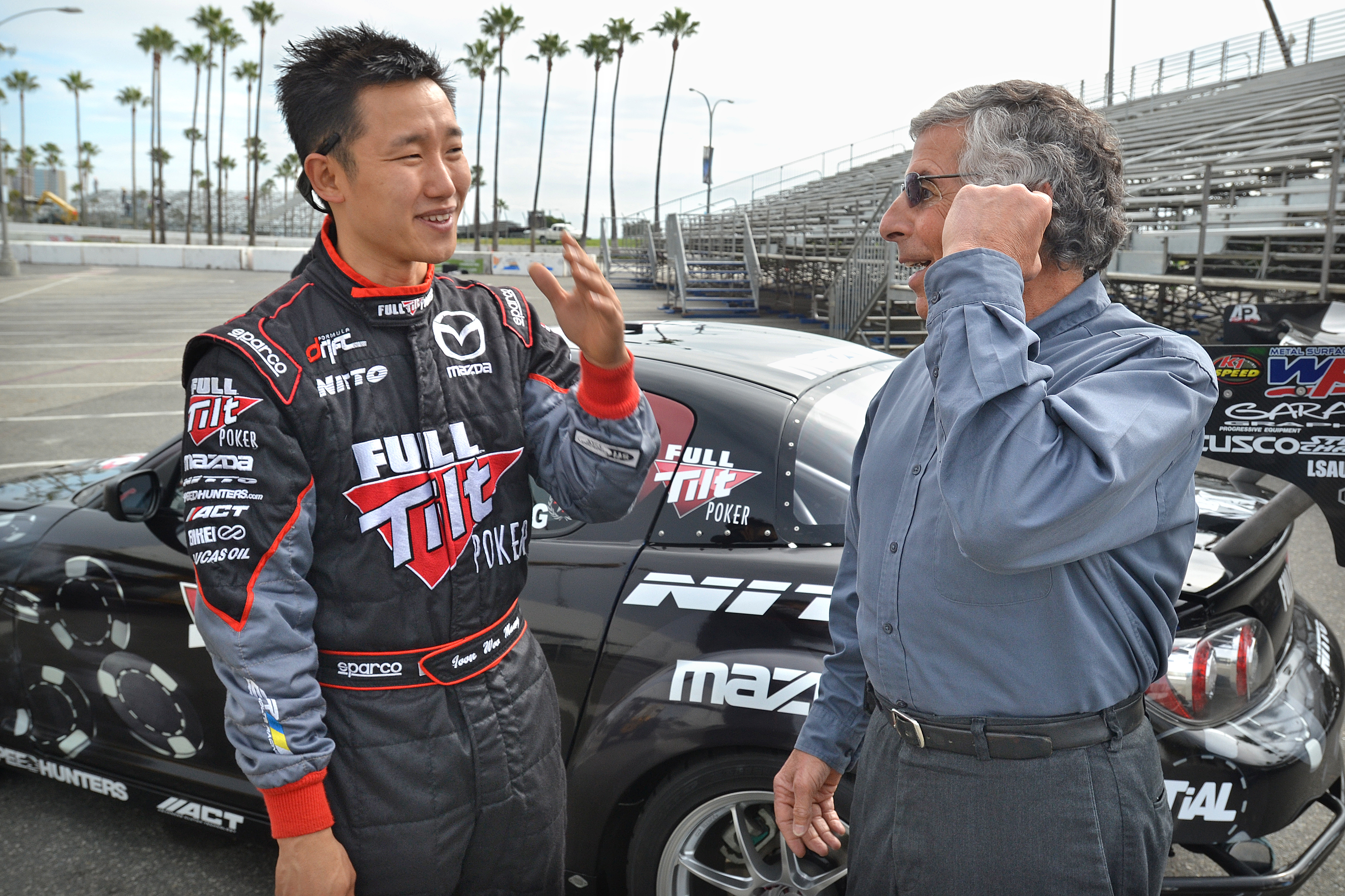 02/15/11: Formula Drift driver Joon Woo Maeng, left, speaks with...