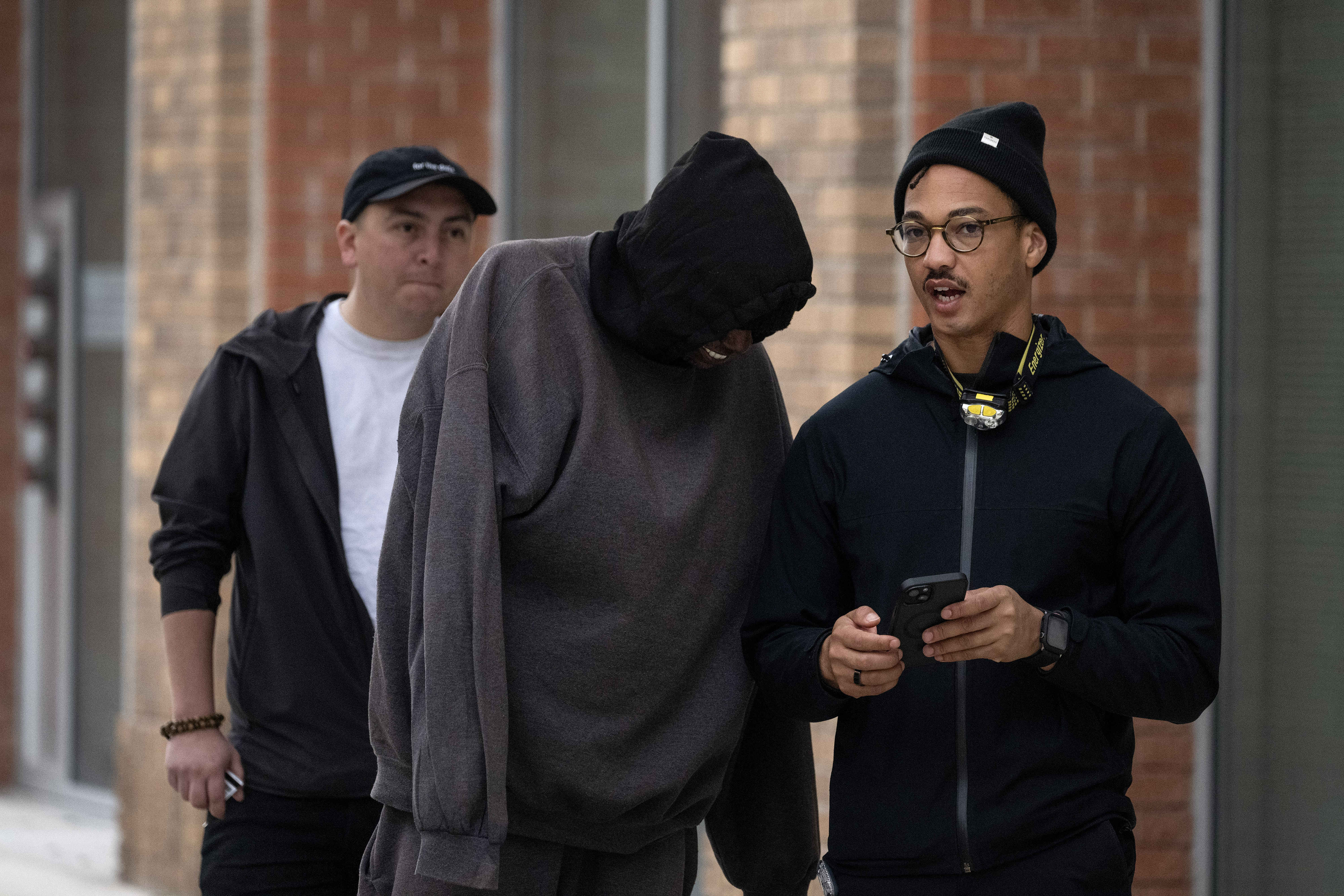 Volunteer Austin Metoyer, right, interviews a person experiencing homelessness during...
