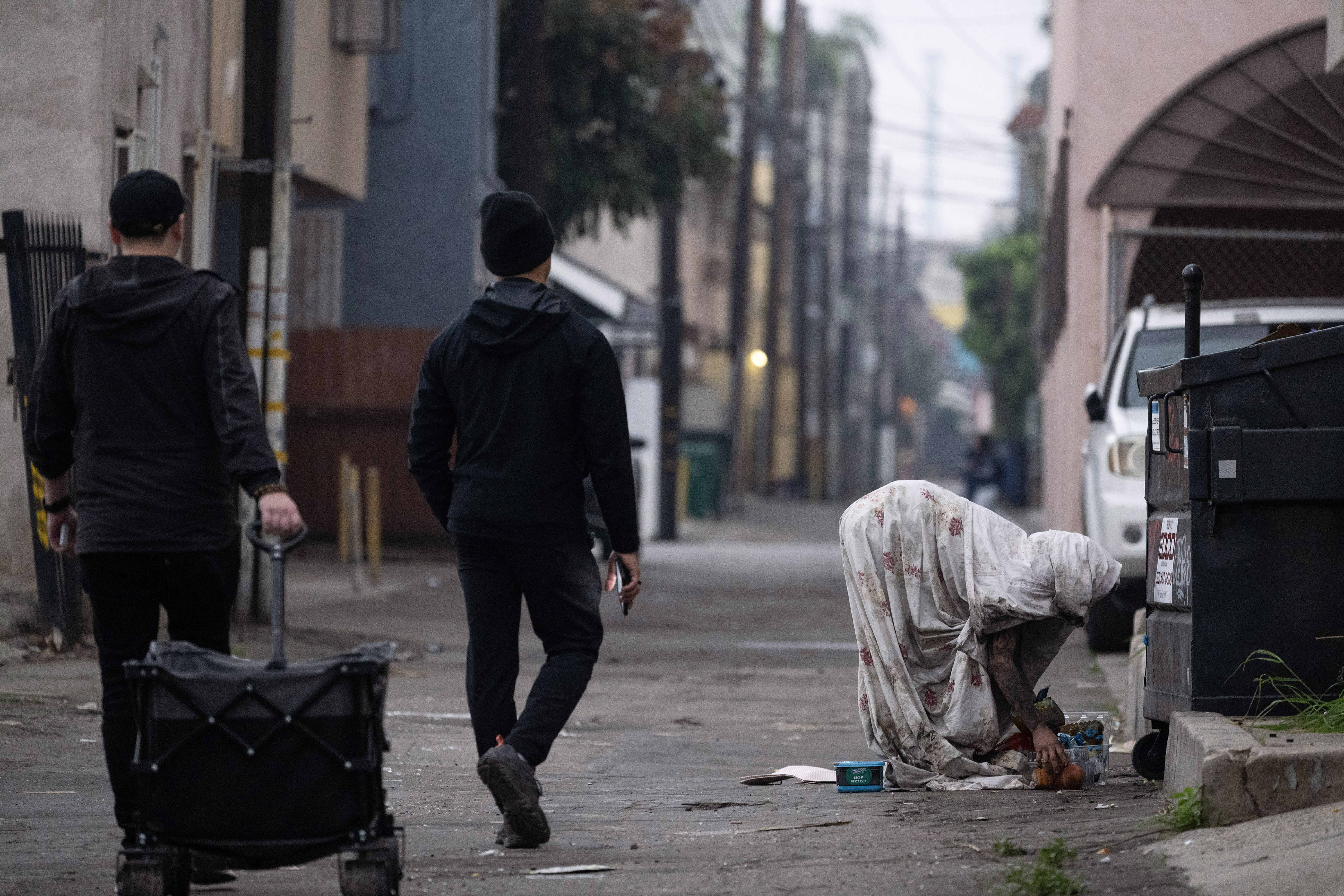 Volunteers approach a person experiencing homelessness during the 2026 Point...
