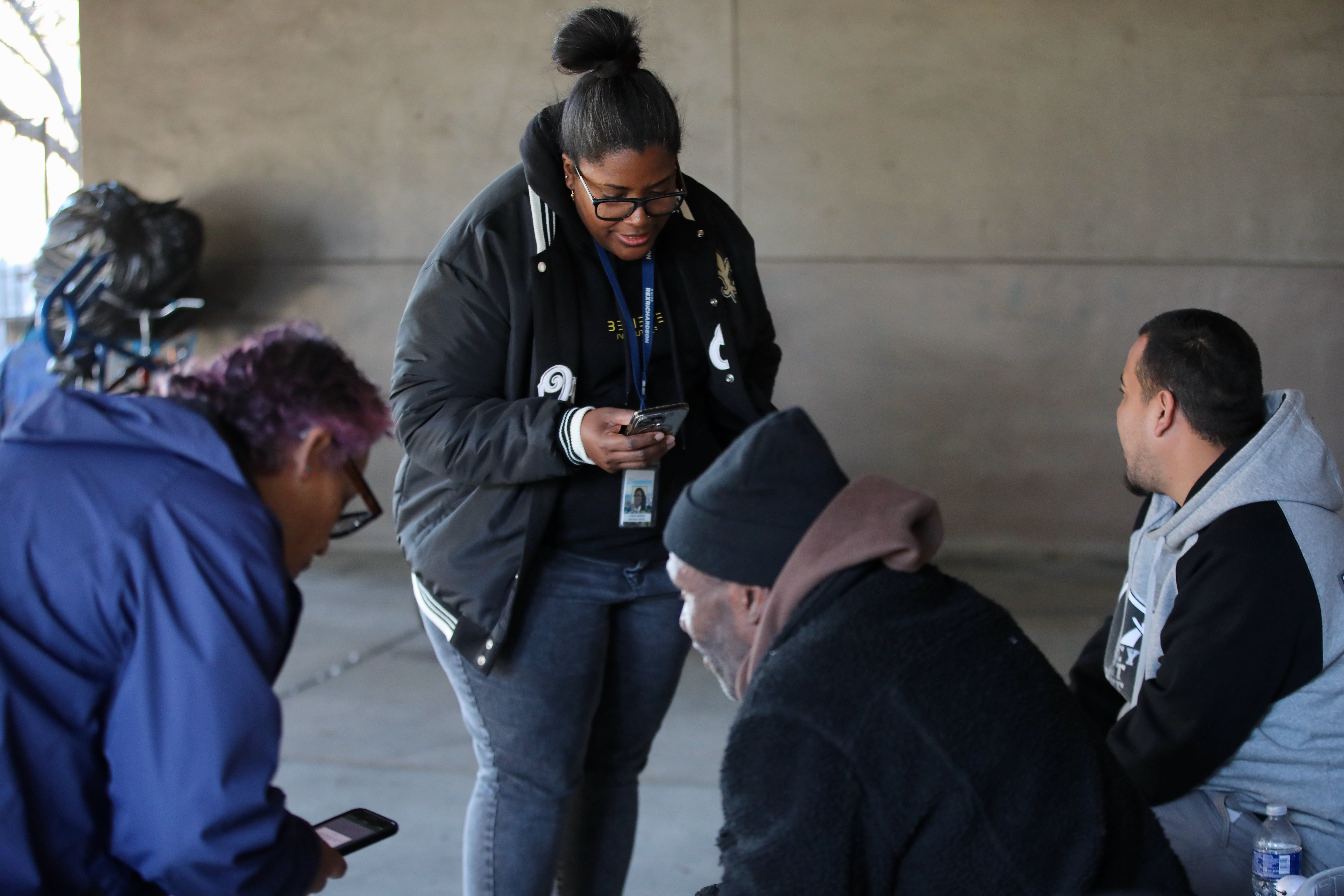 Loren Simpson of Mayor Rex Rex Richardsonâs office, center, offers...