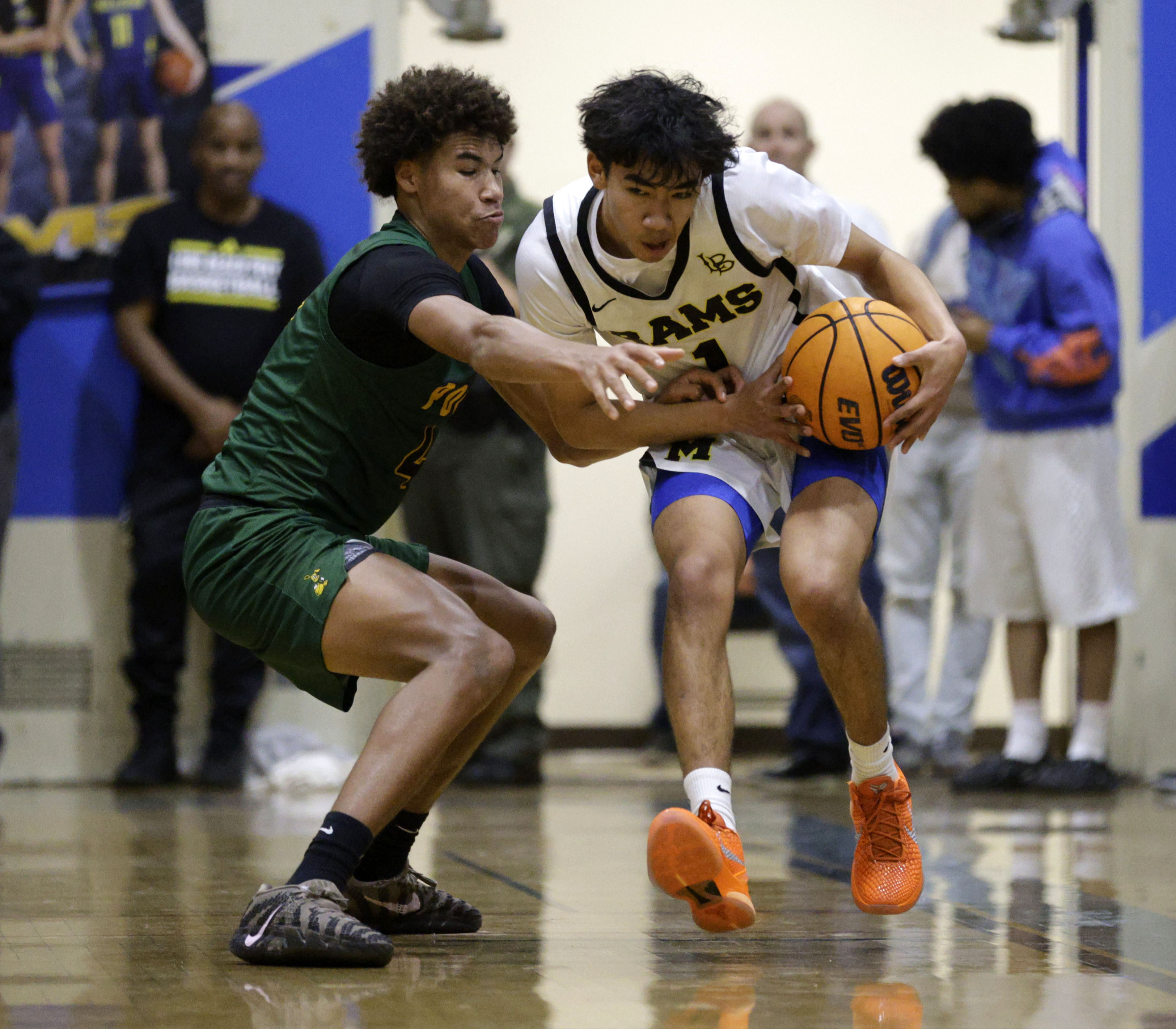 Long Beach Poly’s Jakobi Oware (4) tries to steal the...