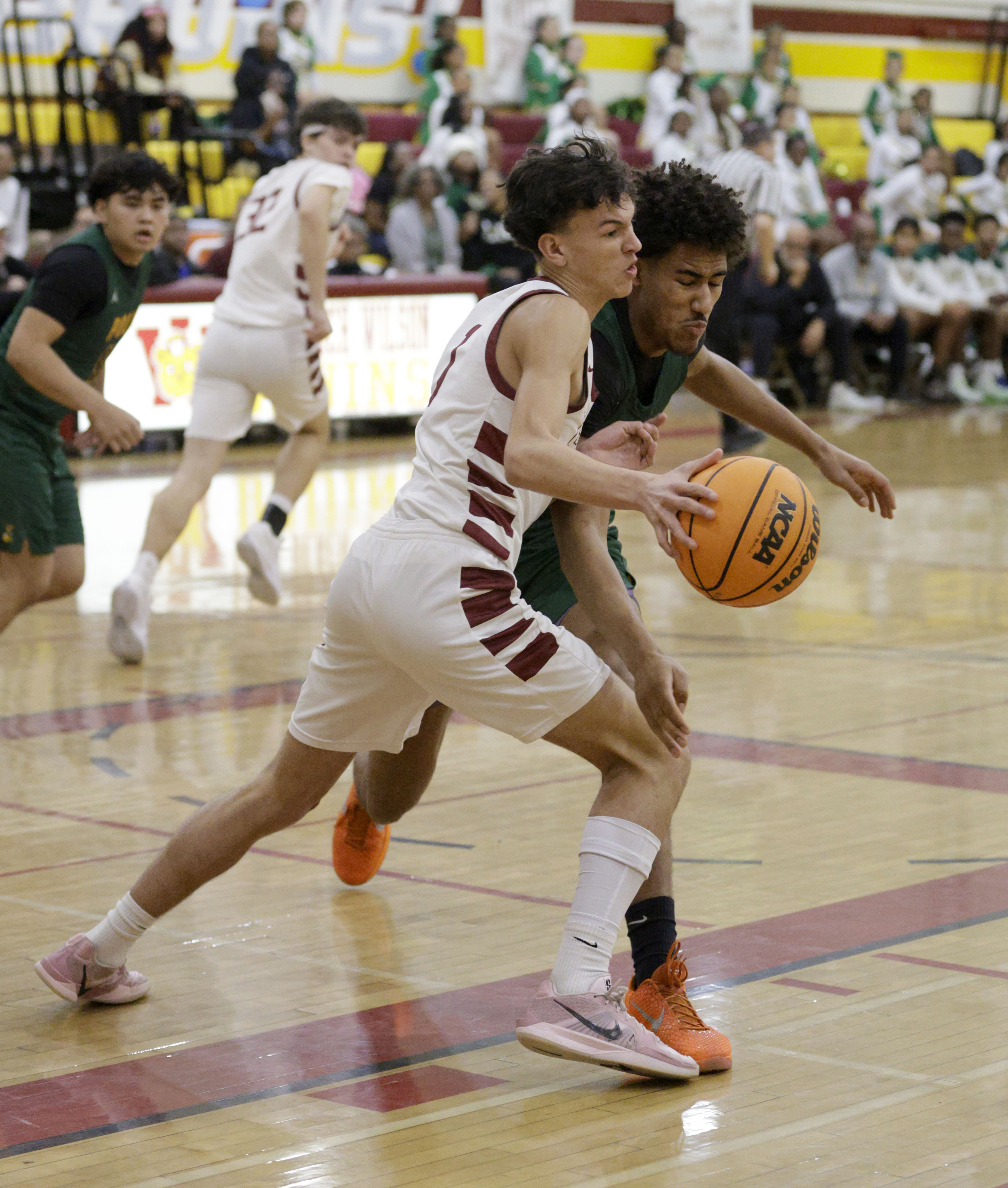 Long Beach Polys Jonas Oware (13) tries to get the...