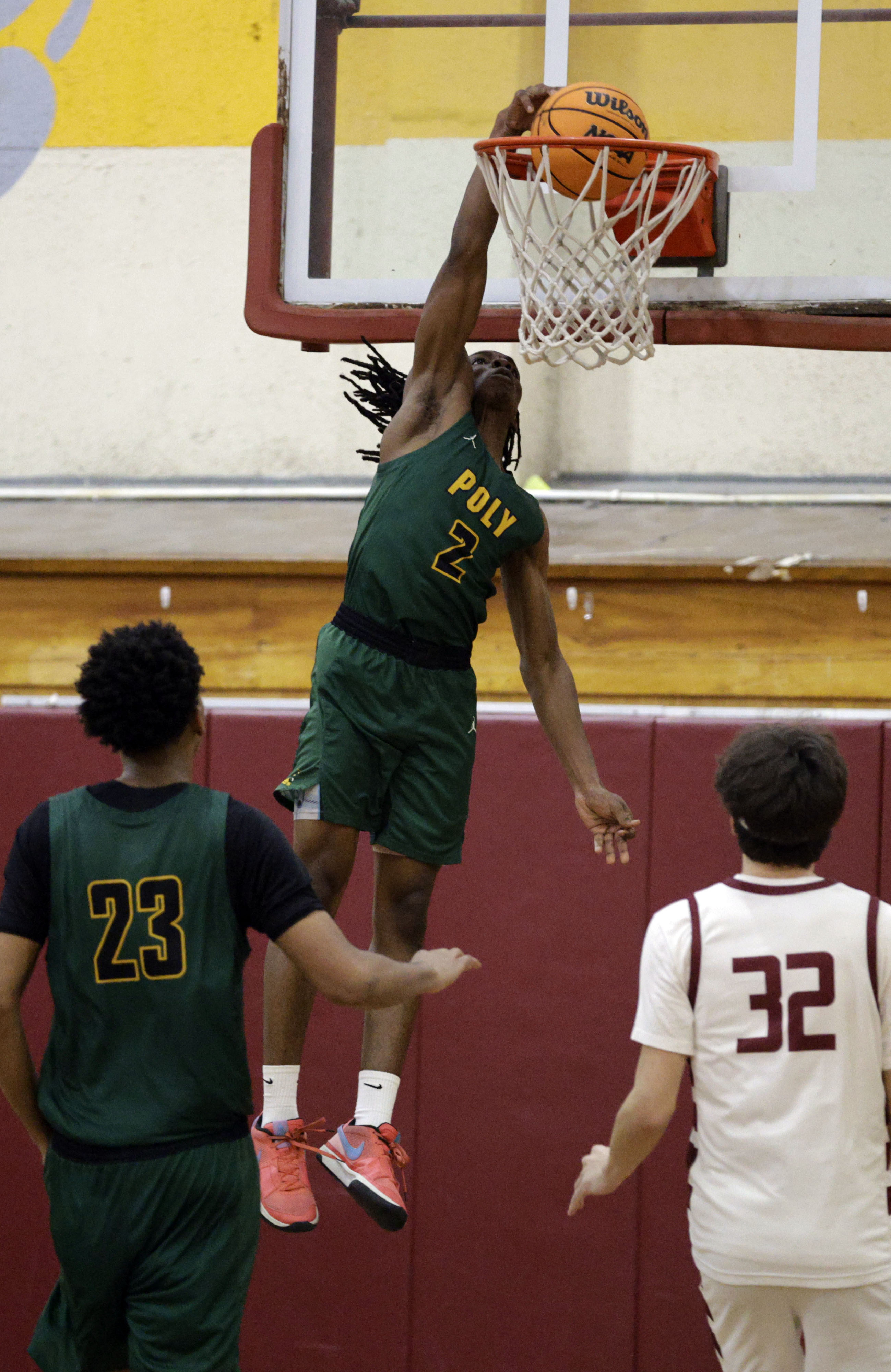 Long Beach Polys Nana Ofoegbu (2) slams the ball in...