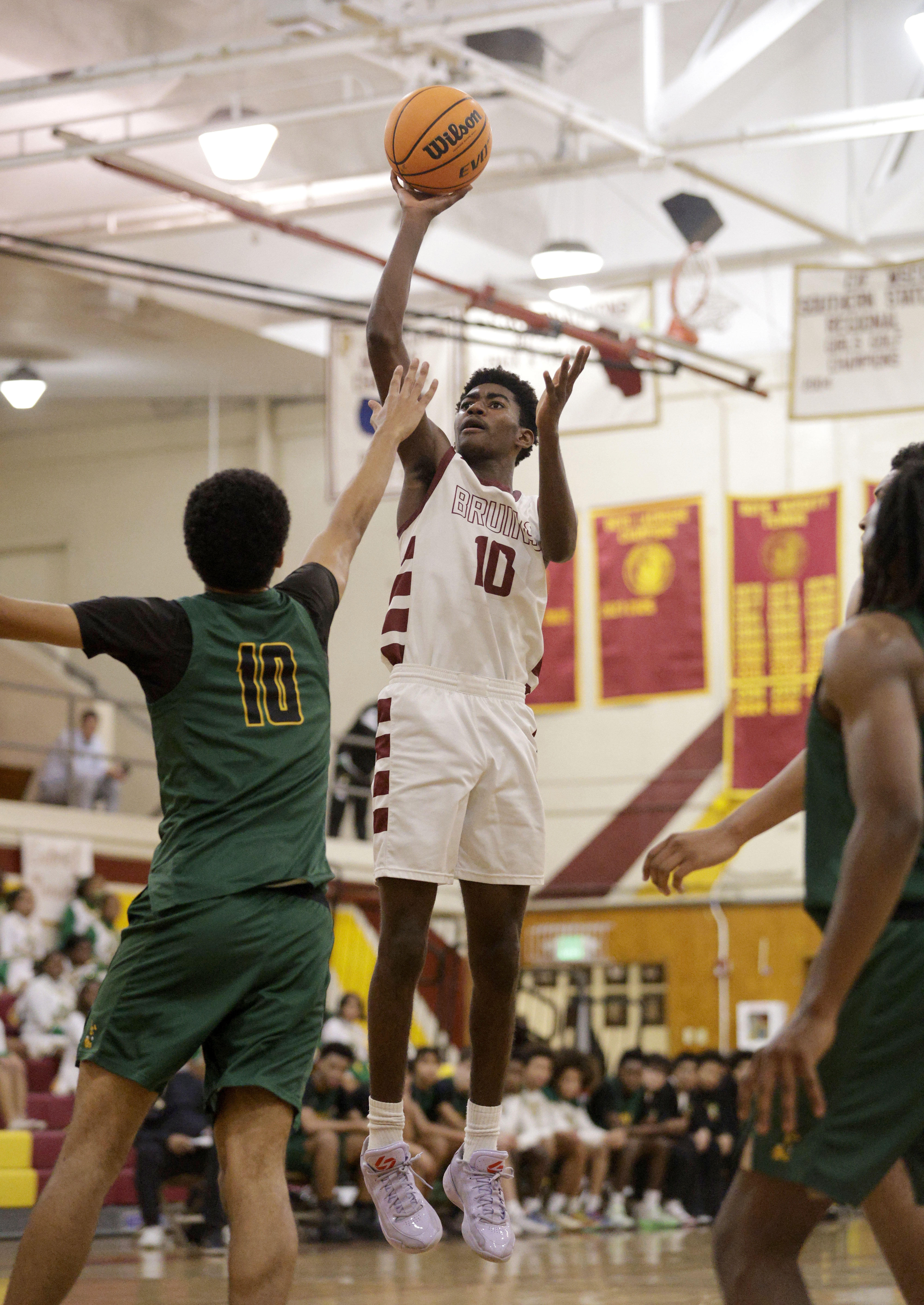 Wilsons Nehemiah Parris (10) goes up for the shot in...