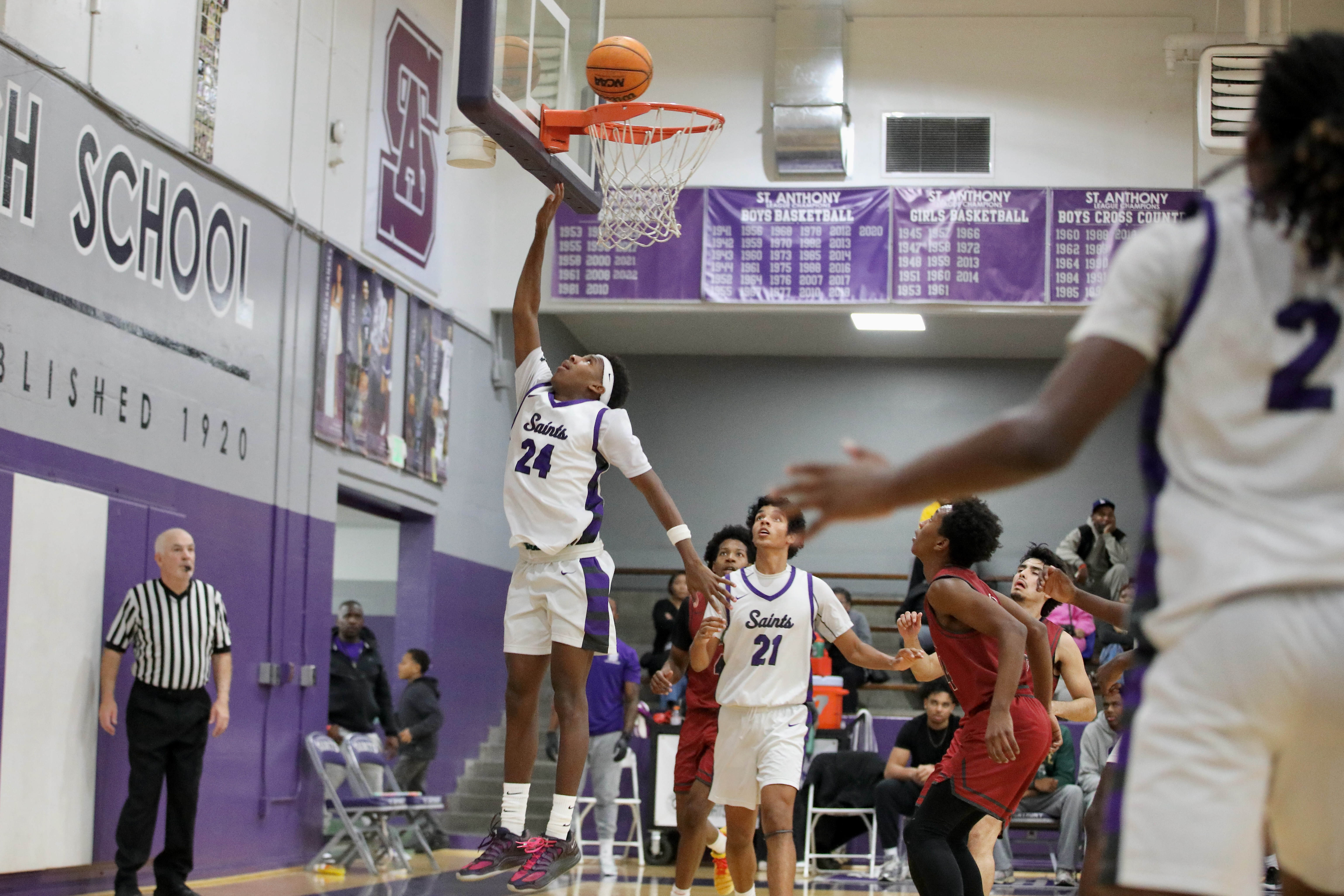 St. Anthony junior Jamil House scores a fourth quarter layup...