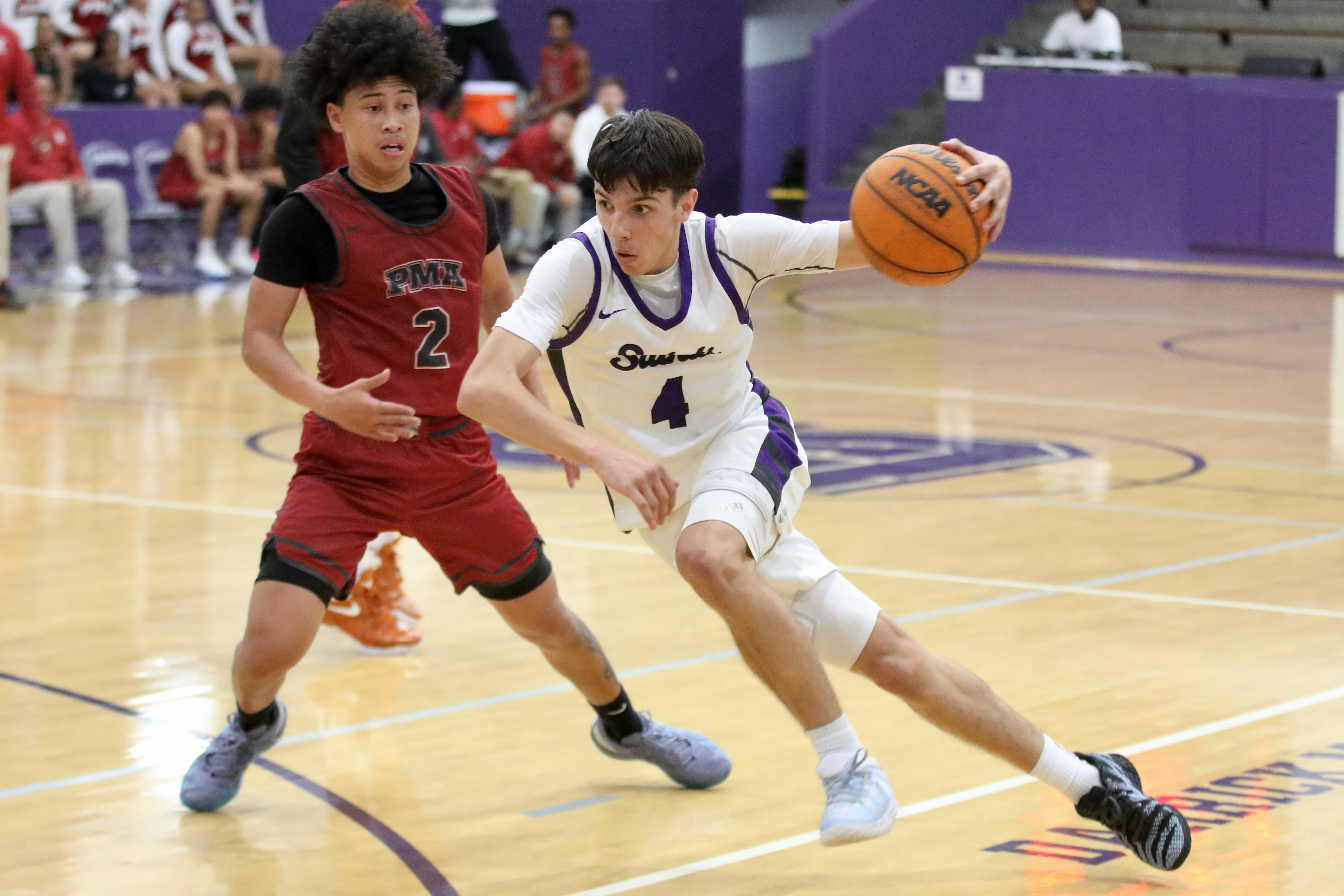 St. Anthonyâs J.R. Quinn Jr. drives around St. Pius X-St....