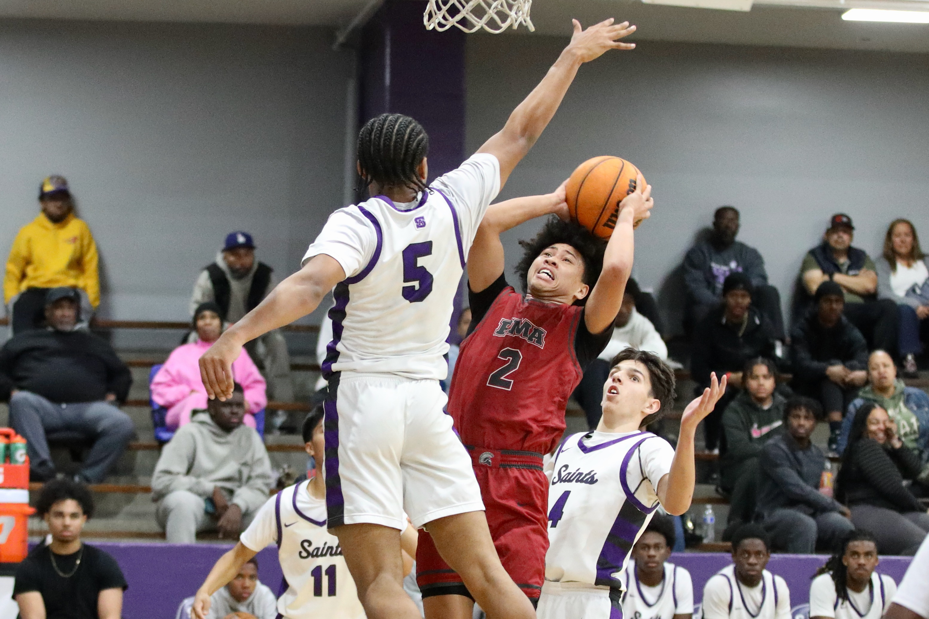 St. Anthonyâs Marinio Elissaint blocks a shot by St. Pius...