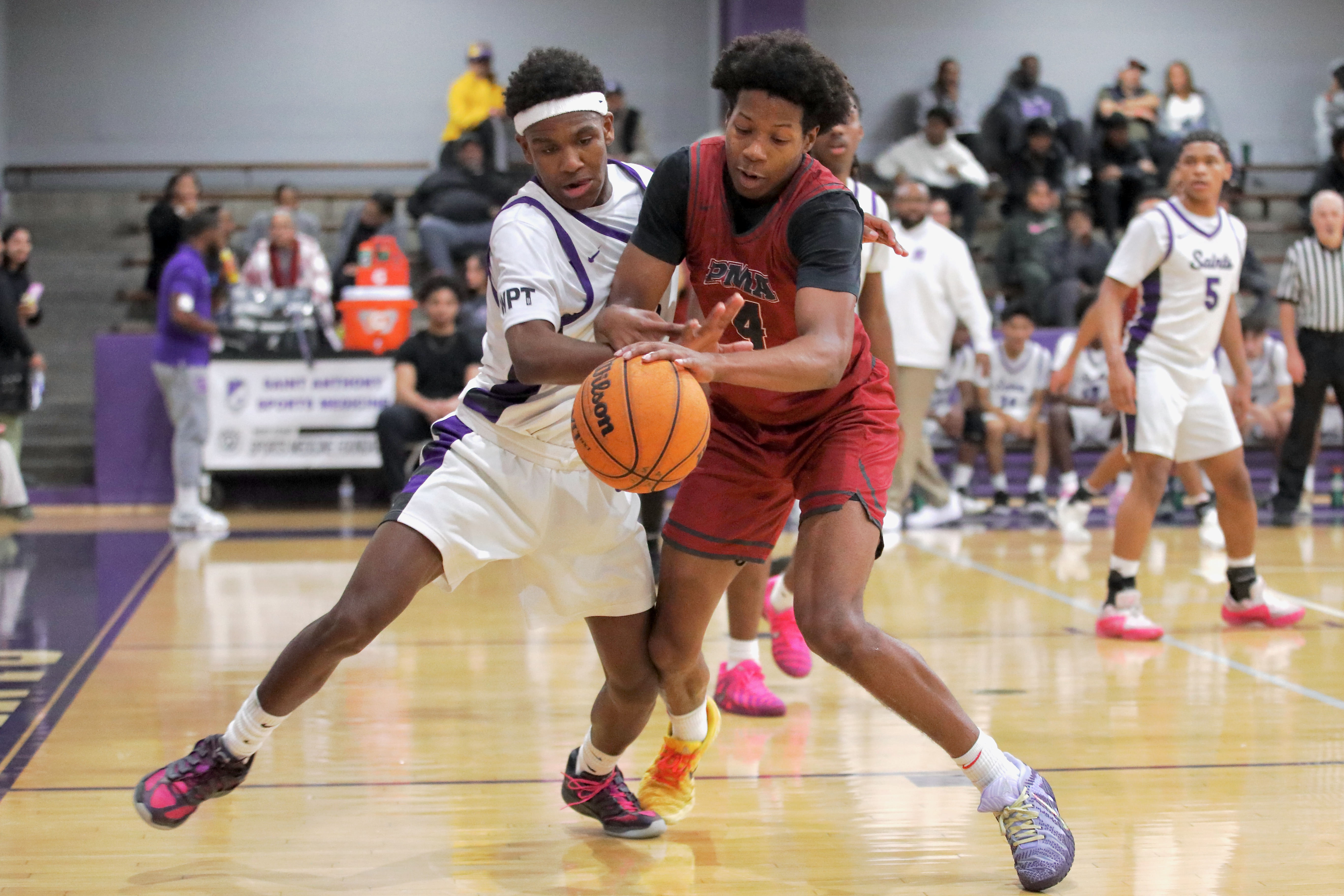 St. Pius X-St. Matthiasâ Dayvion Gates grabs a rebound in...